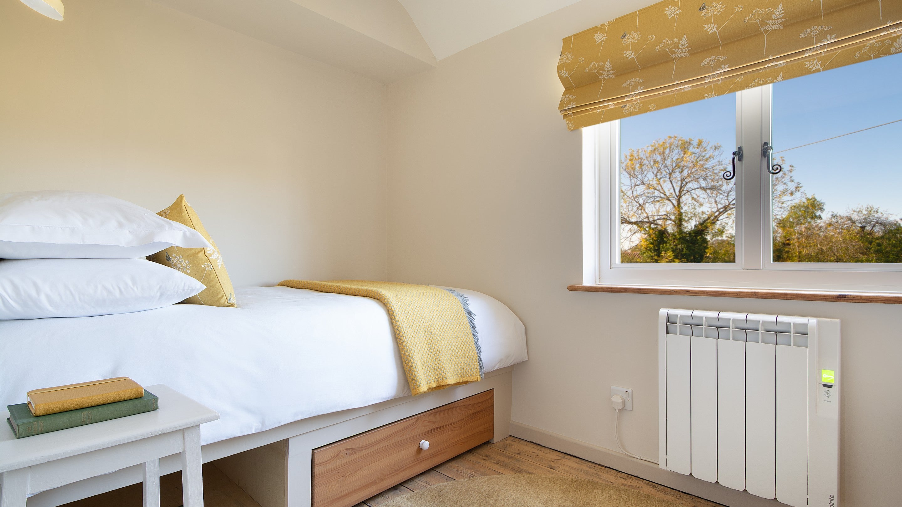 One of the beds in the twin bedroom at Cladium, with storage under the bed, Cambridgeshire