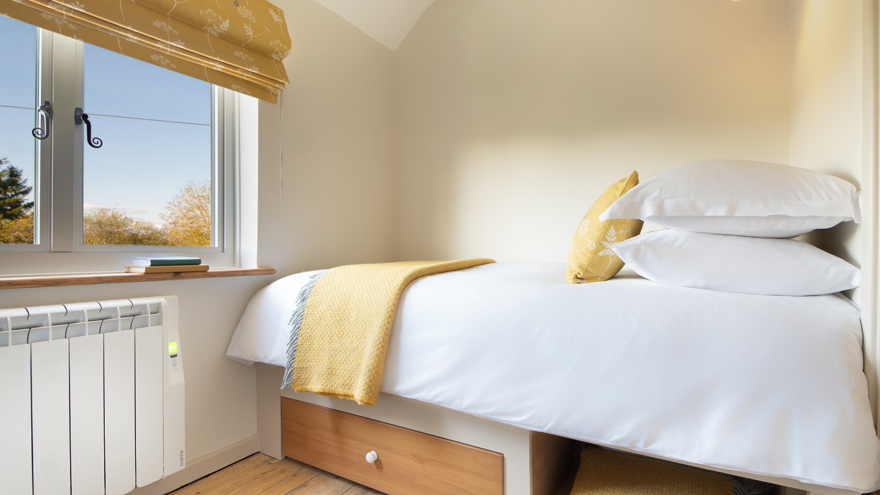 One of the beds in the twin bedroom at Cladium, with storage under the bed, Cambridgeshire