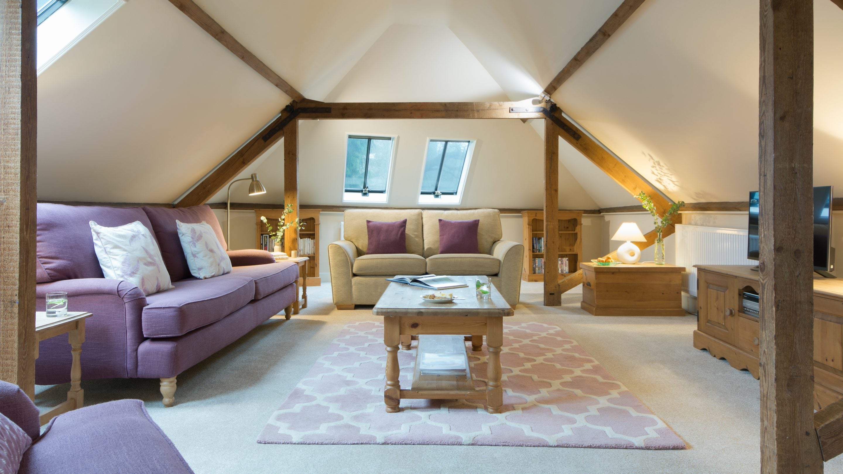 The sitting area in the open-plan room at Coach House Loft, Cambridgeshire