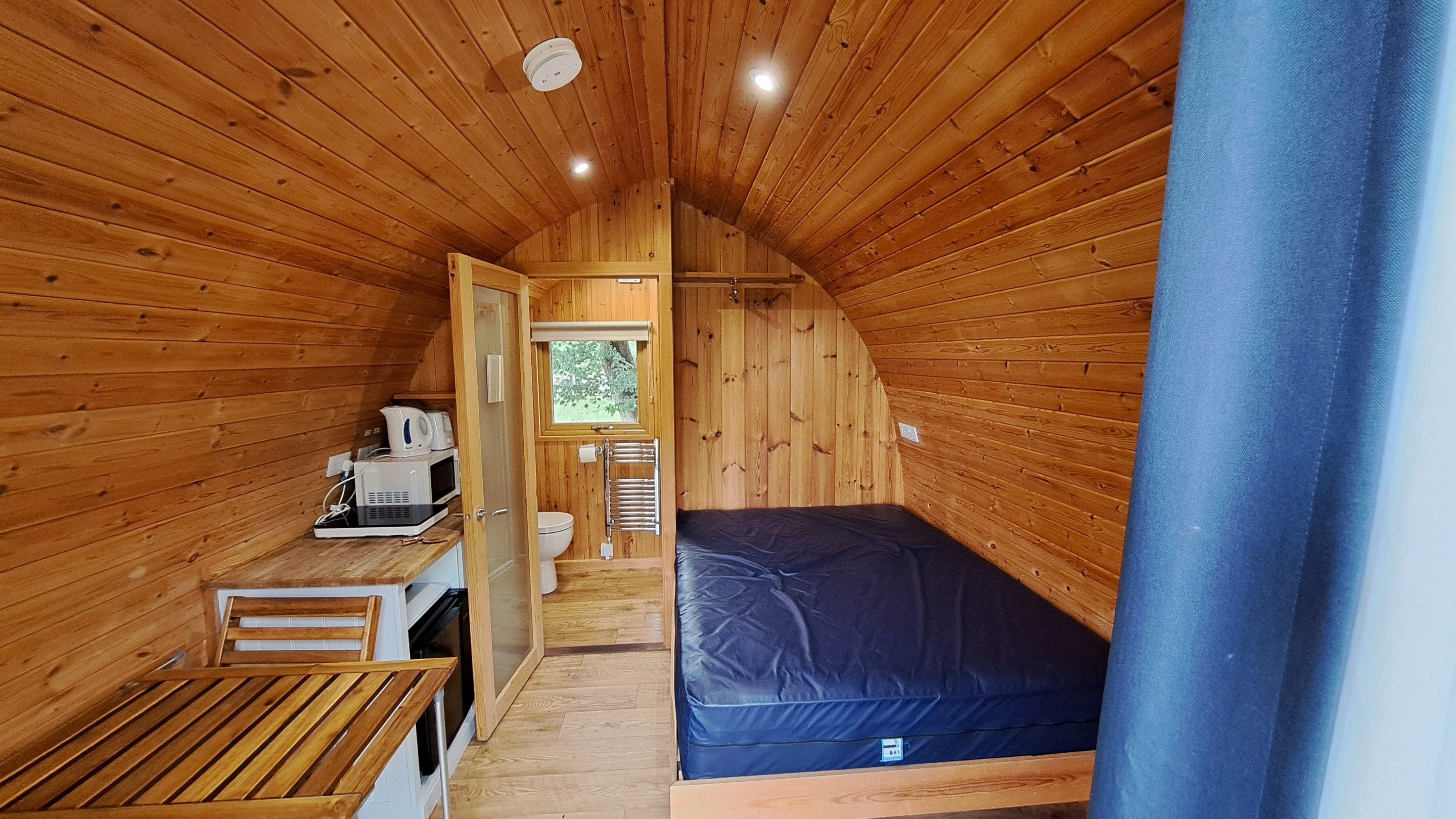 The interior of the Furnished Pod with Kitchenette and En-suite Shower at Waterclose Meadows, Cambridgeshire