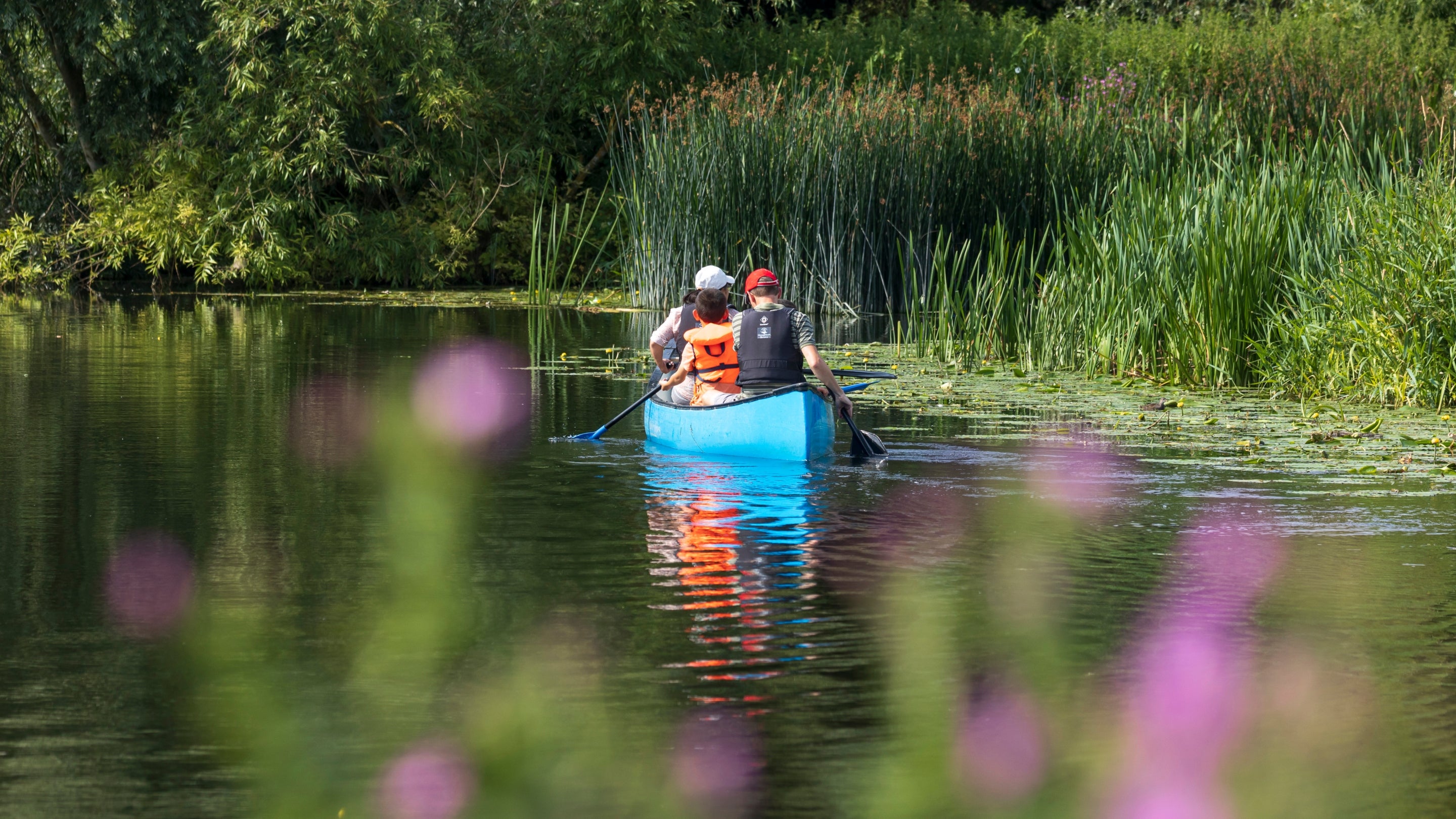 Guests enjoying the waterways near Waterclose Meadows Campsite, Cambridgeshire