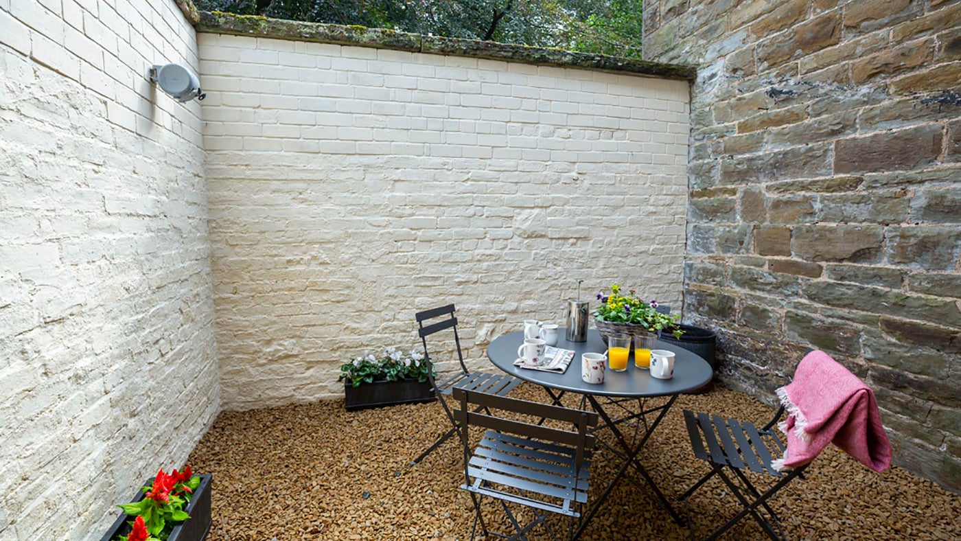 The outdoor seating area at Lyme West Lodge, Cheshire