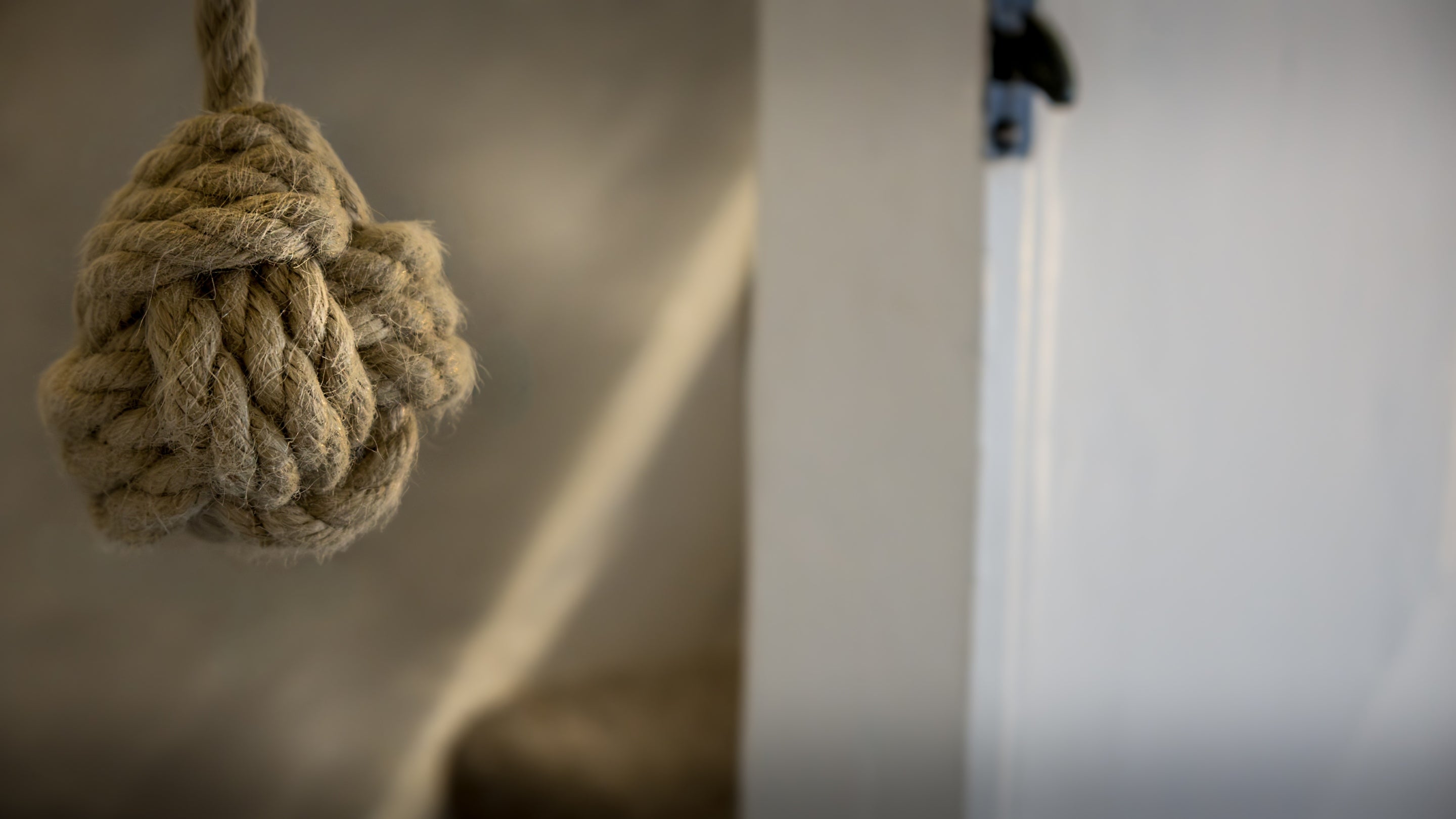 The rope handhold at the bottom of the stairs to the bedroom at The Birdcage, Cornwall