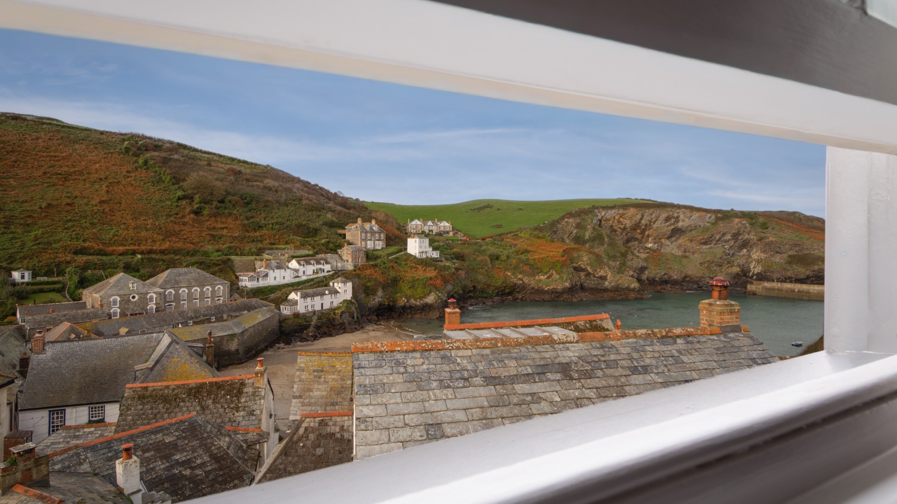 The view of the sea, beach and Port Isaac village from the bedroom of The Birdcage, Cornwall