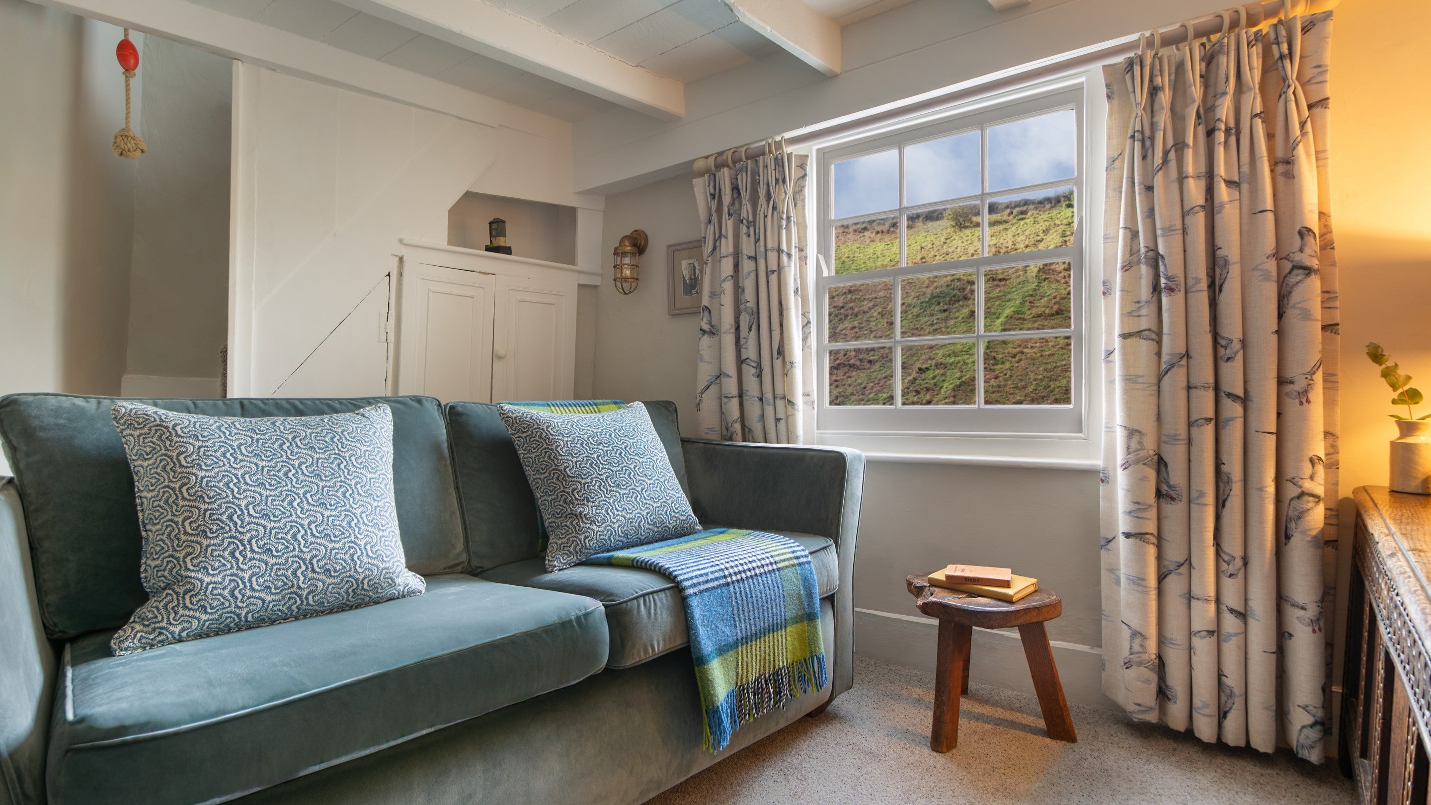 The sofa in the sitting room on the first floor of The Birdcage, Cornwall