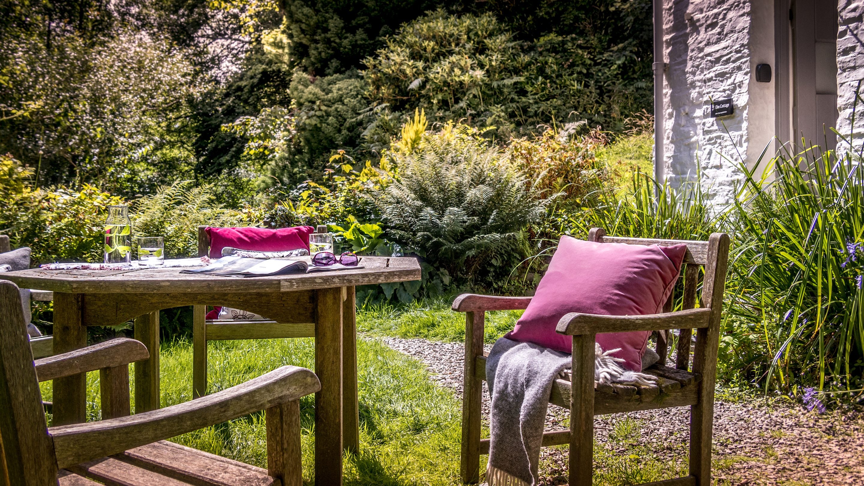 The outdoor dining table in the front garden at Boscastle Elm Cottage, Cornwall