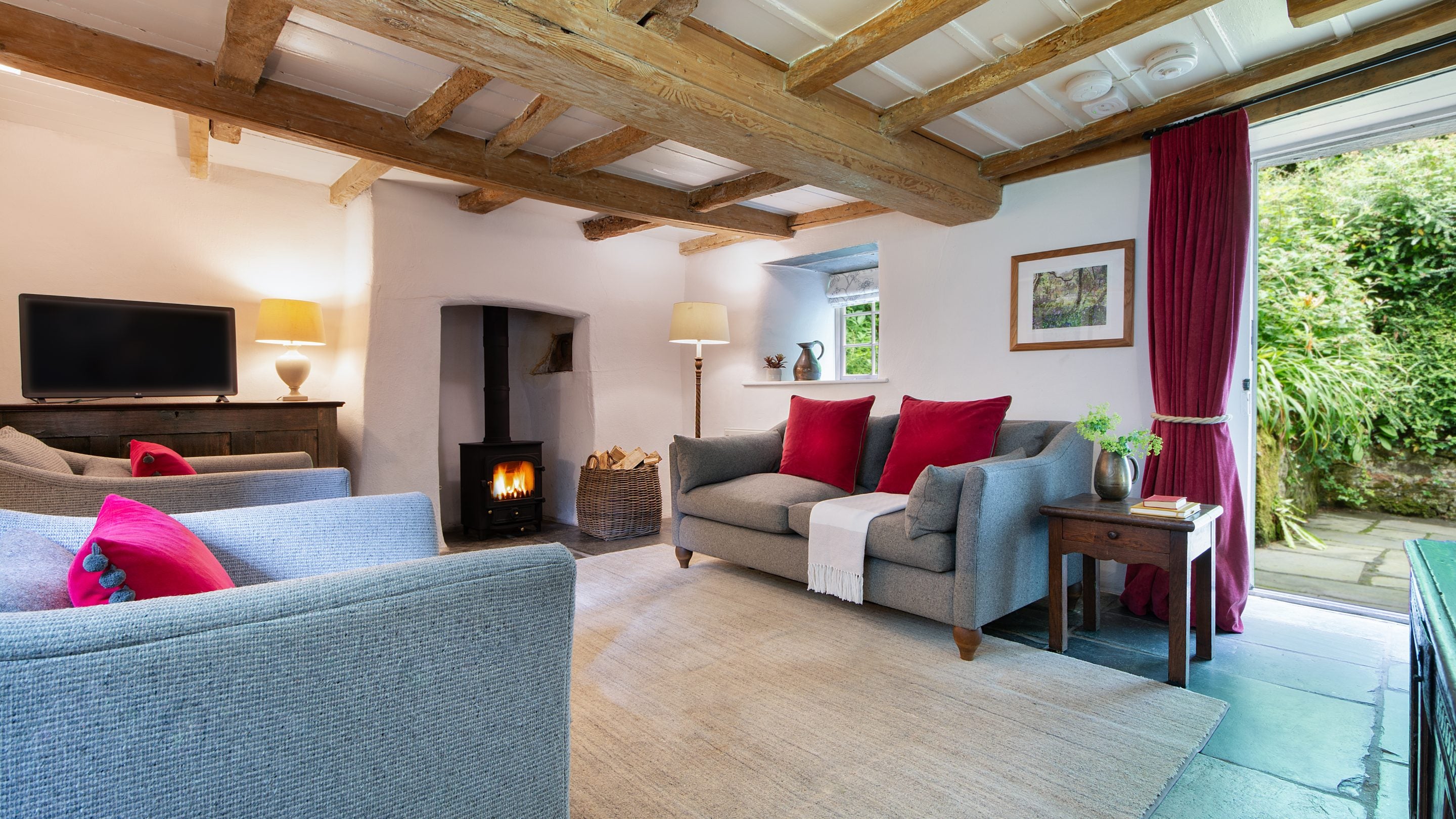 The sitting room at Boscastle Elm Cottage, the back door opens onto a path leading to the front garden, Cornwall
