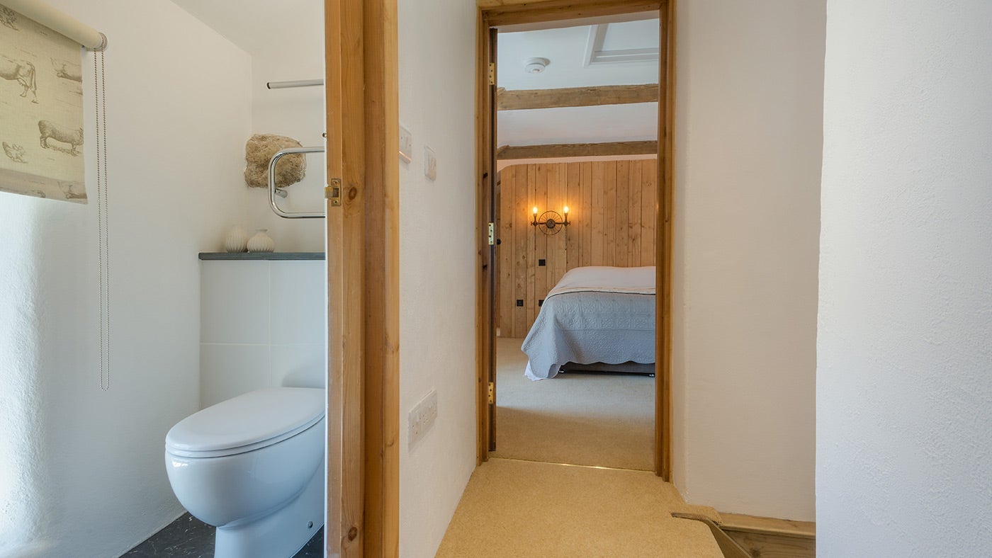 The toilet and hallway on the first floor of Bosigran Cottage, Cornwall