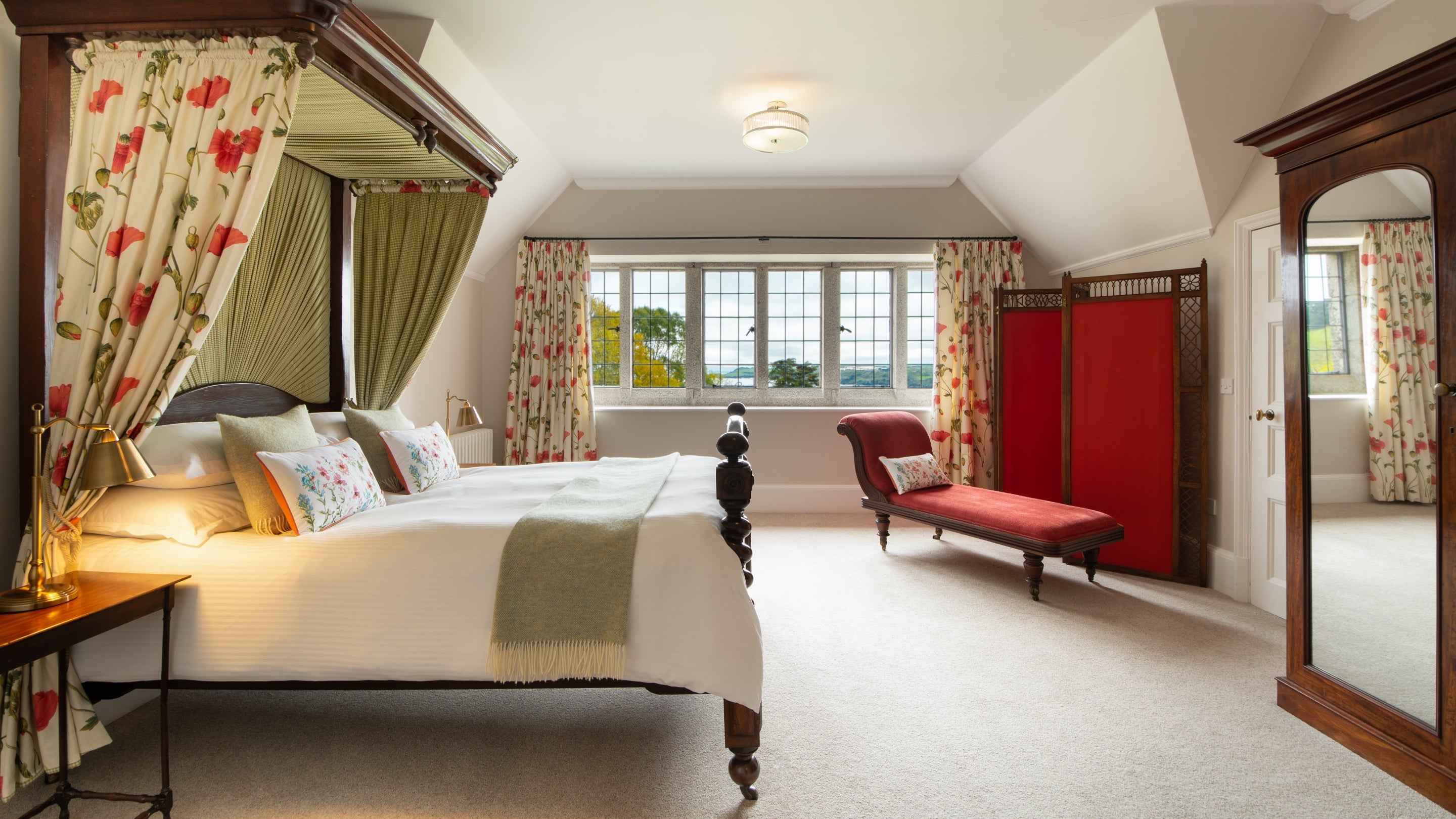The four-poster bedroom at Bosveal, Cornwall