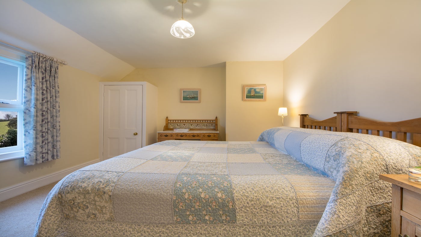 The double bedroom at Caragloose Farm House, Roseland, Cornwall