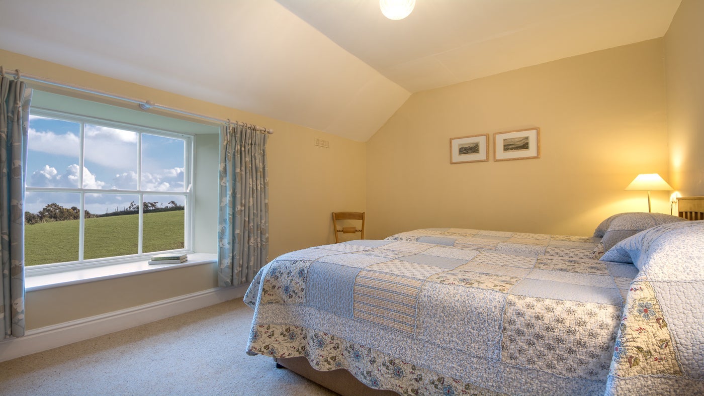 The first twin bedroom at Caragloose Farm House, Roseland, Cornwall