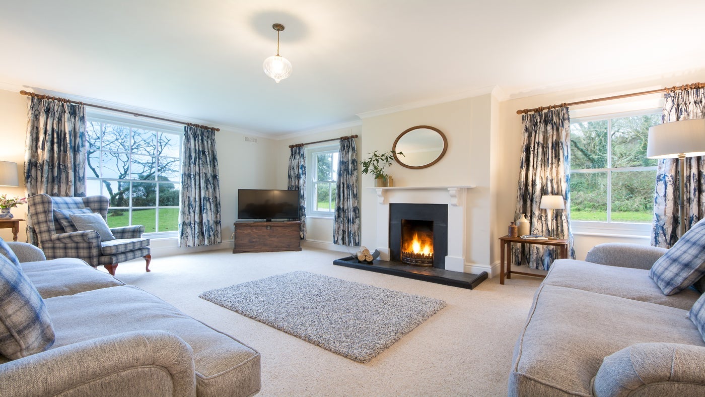 The sitting room at Caragloose Farm House, Roseland, Cornwall