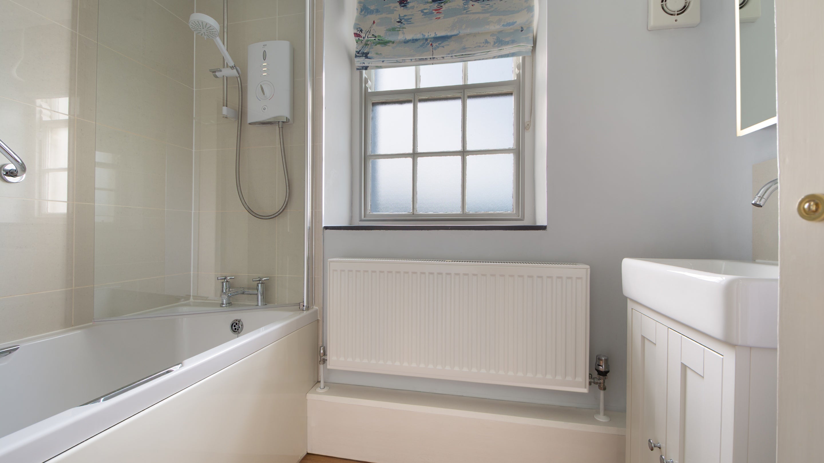The bathroom with shower over bath at Carnweather, Cornwall