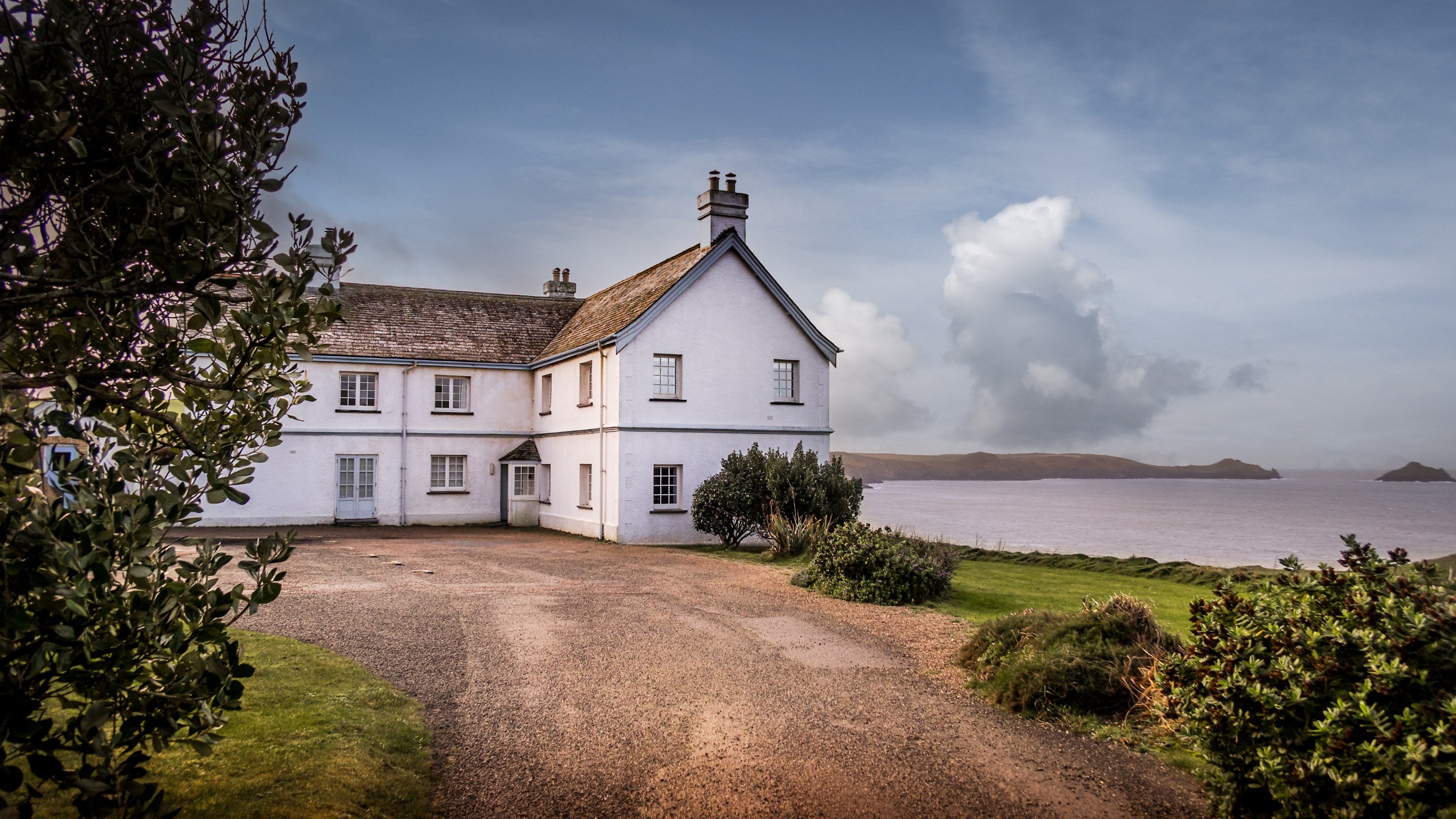 Doyden House and sea views across the bay towards Pentire, Cornwall
