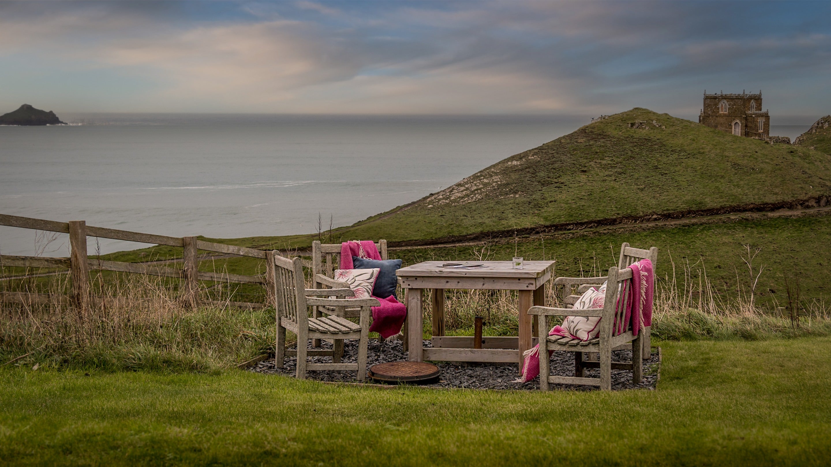 The shared garden with outdoor furniture at Carnweather, Cornwall