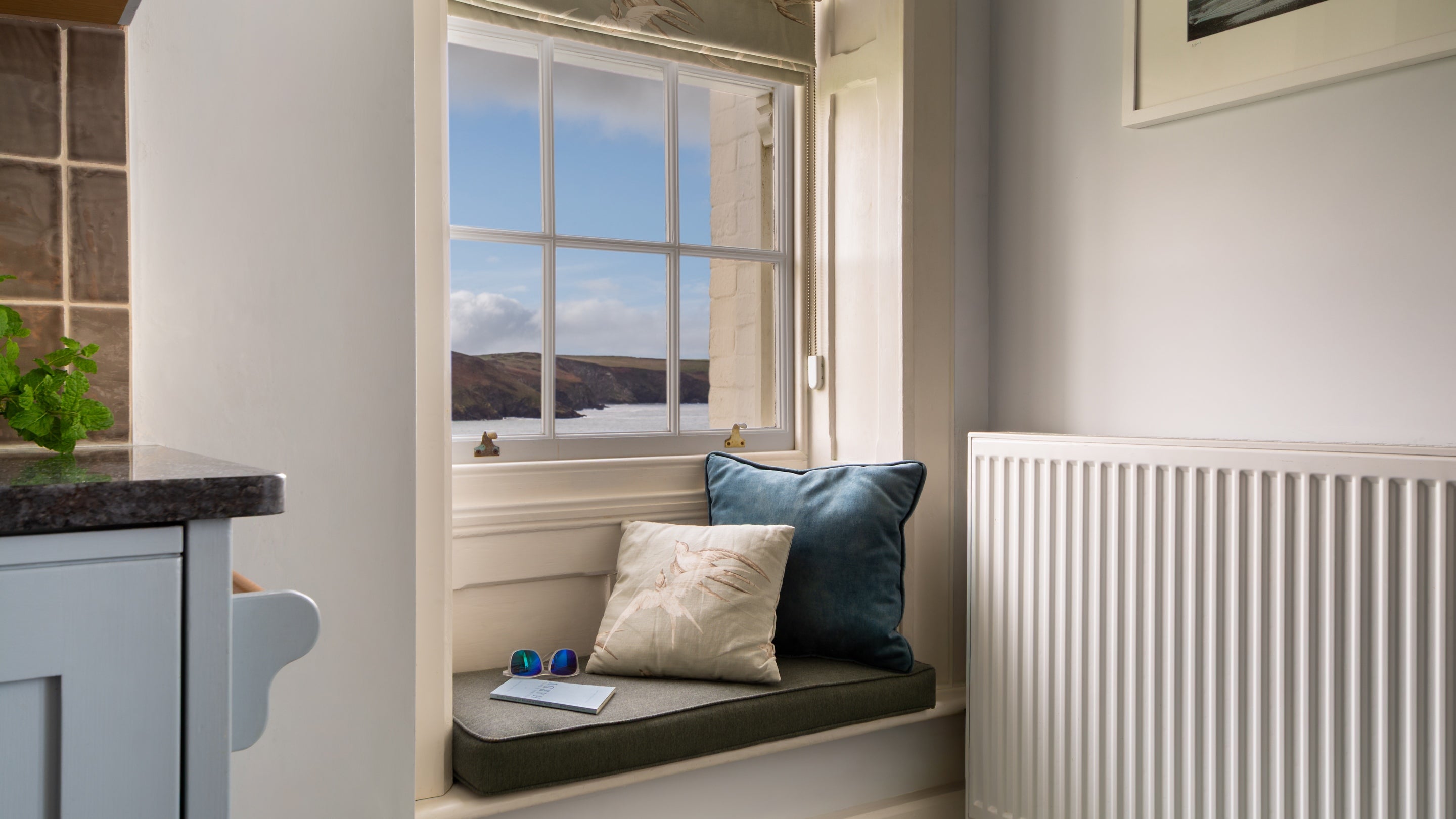 A window seat with sea views in the kitchen-diner at Carnweather, Cornwall