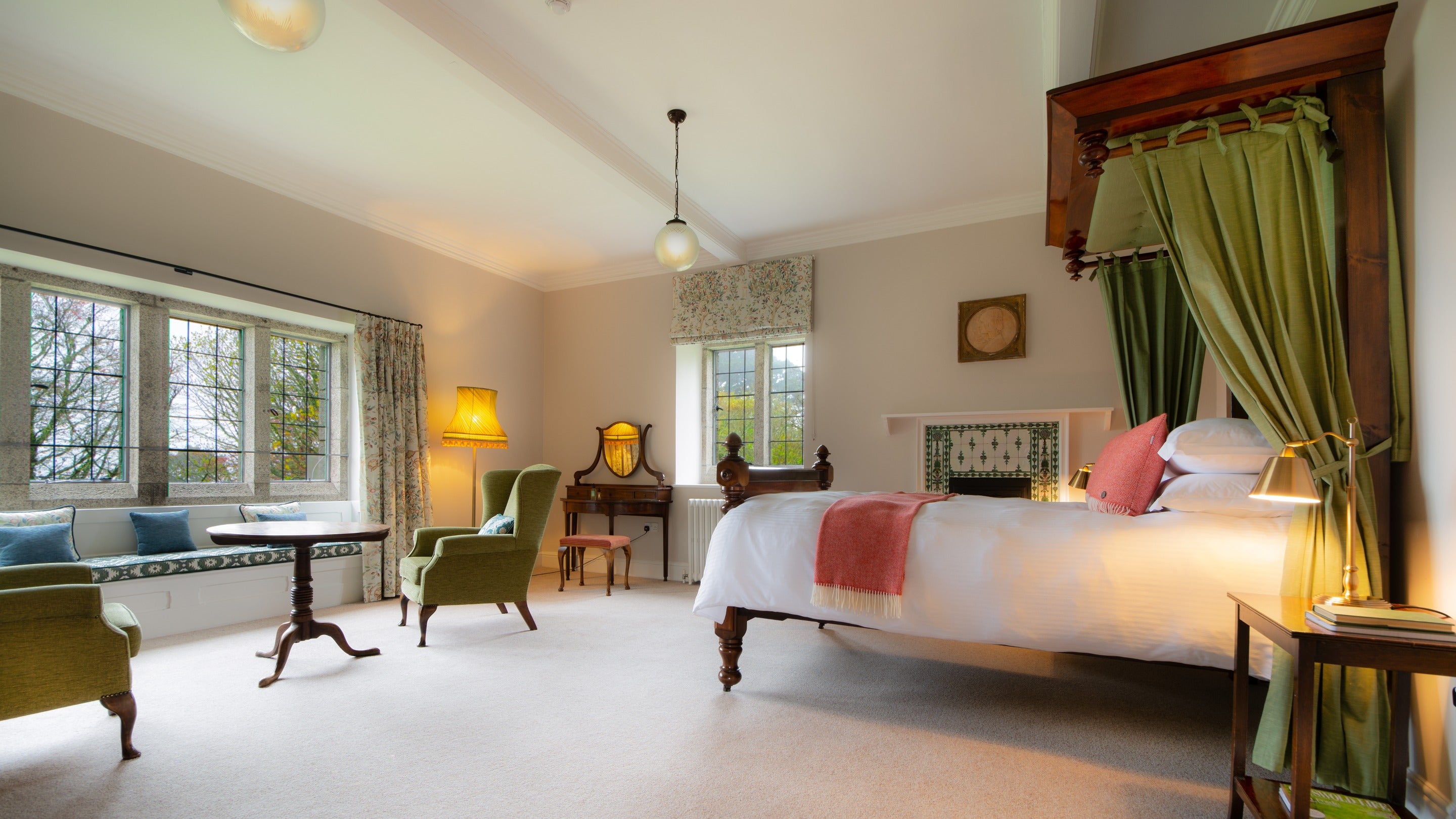 The double bedroom with canopy bed and en-suite bathroom at Chatham, Cornwall