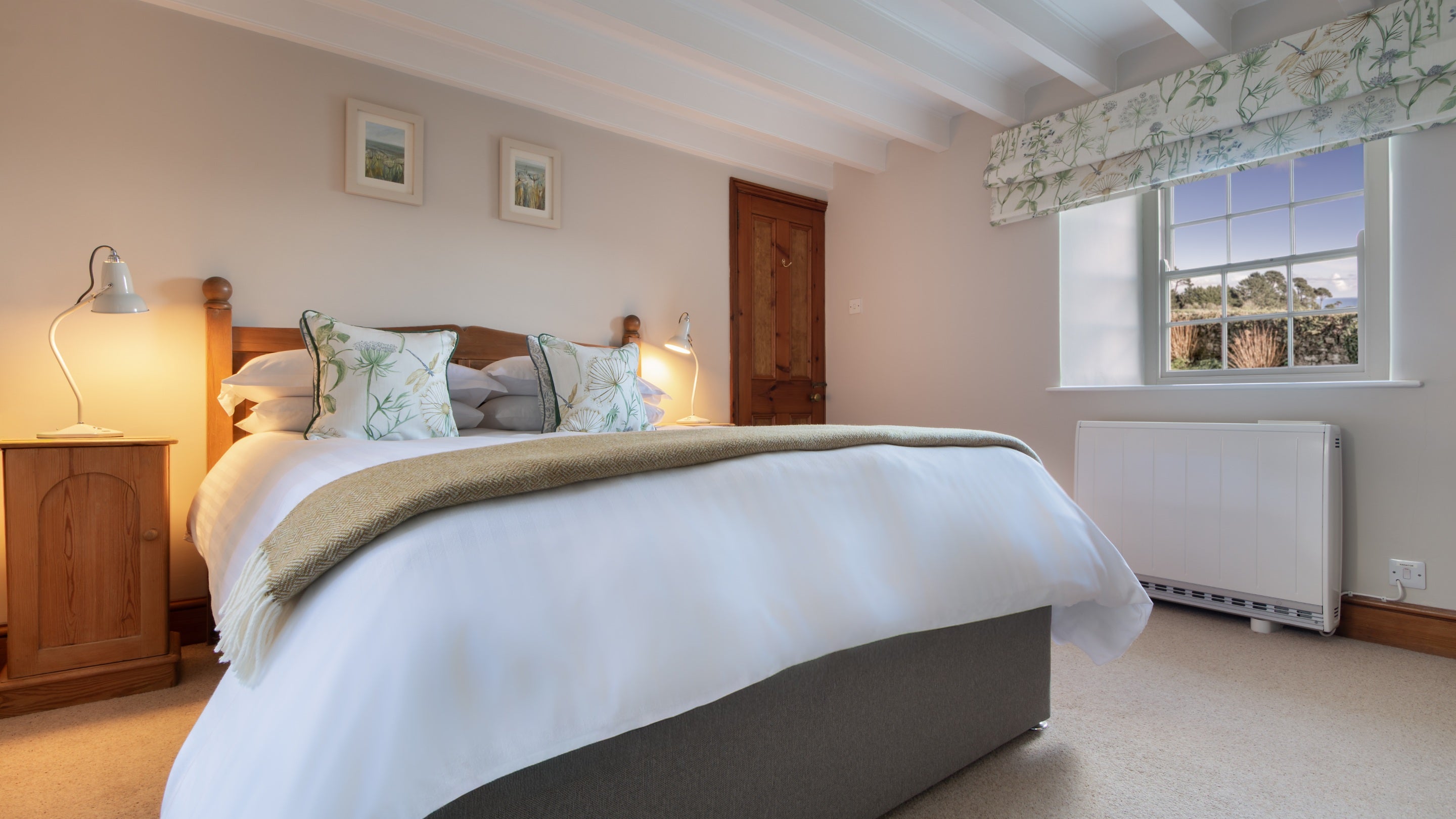 The double bedroom with en-suite shower room on the ground floor of Chenhalls Barn, Cornwall