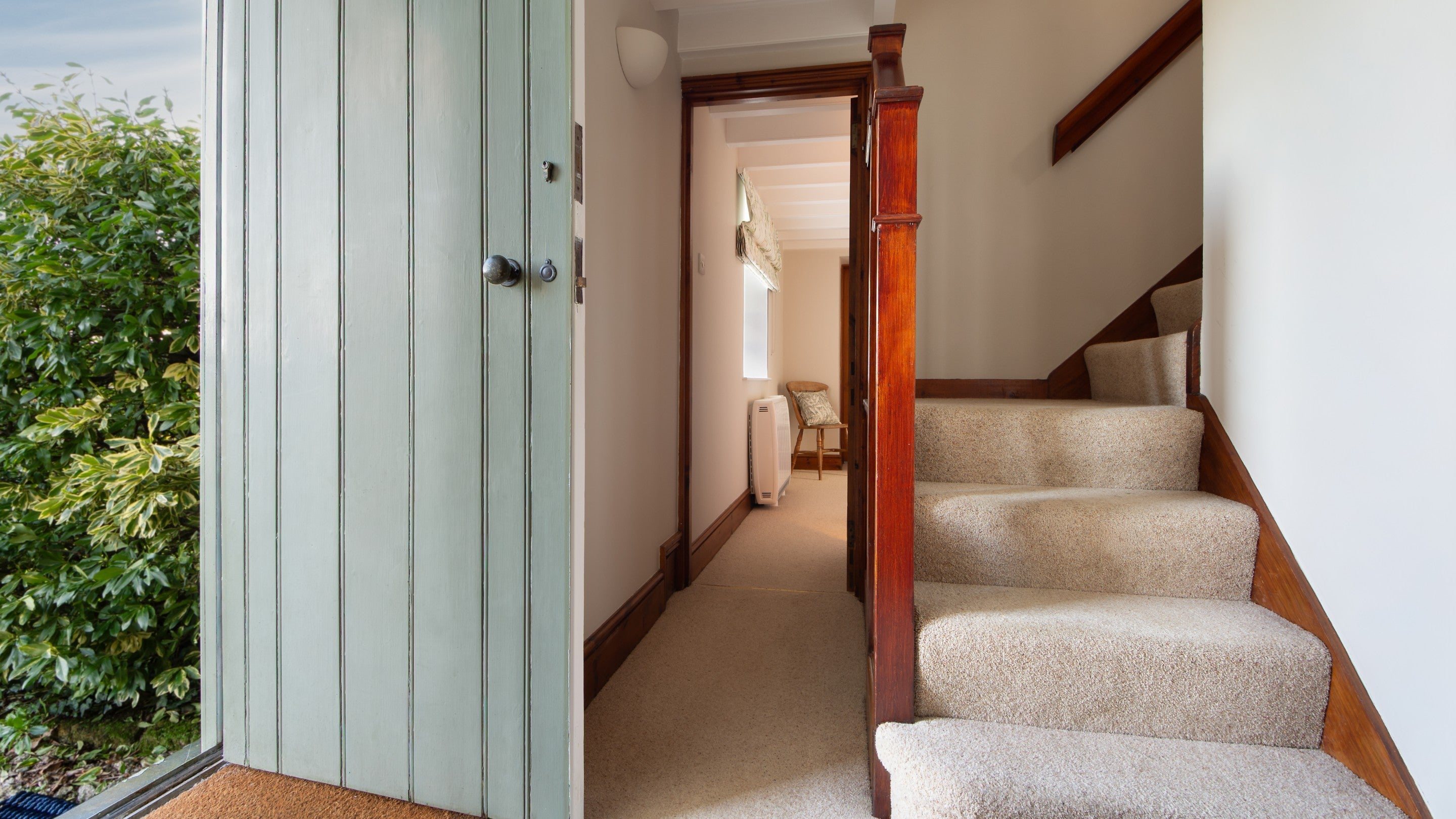 The hallway on the ground floor of Chenhalls Barn with door to the garden, Cornwall