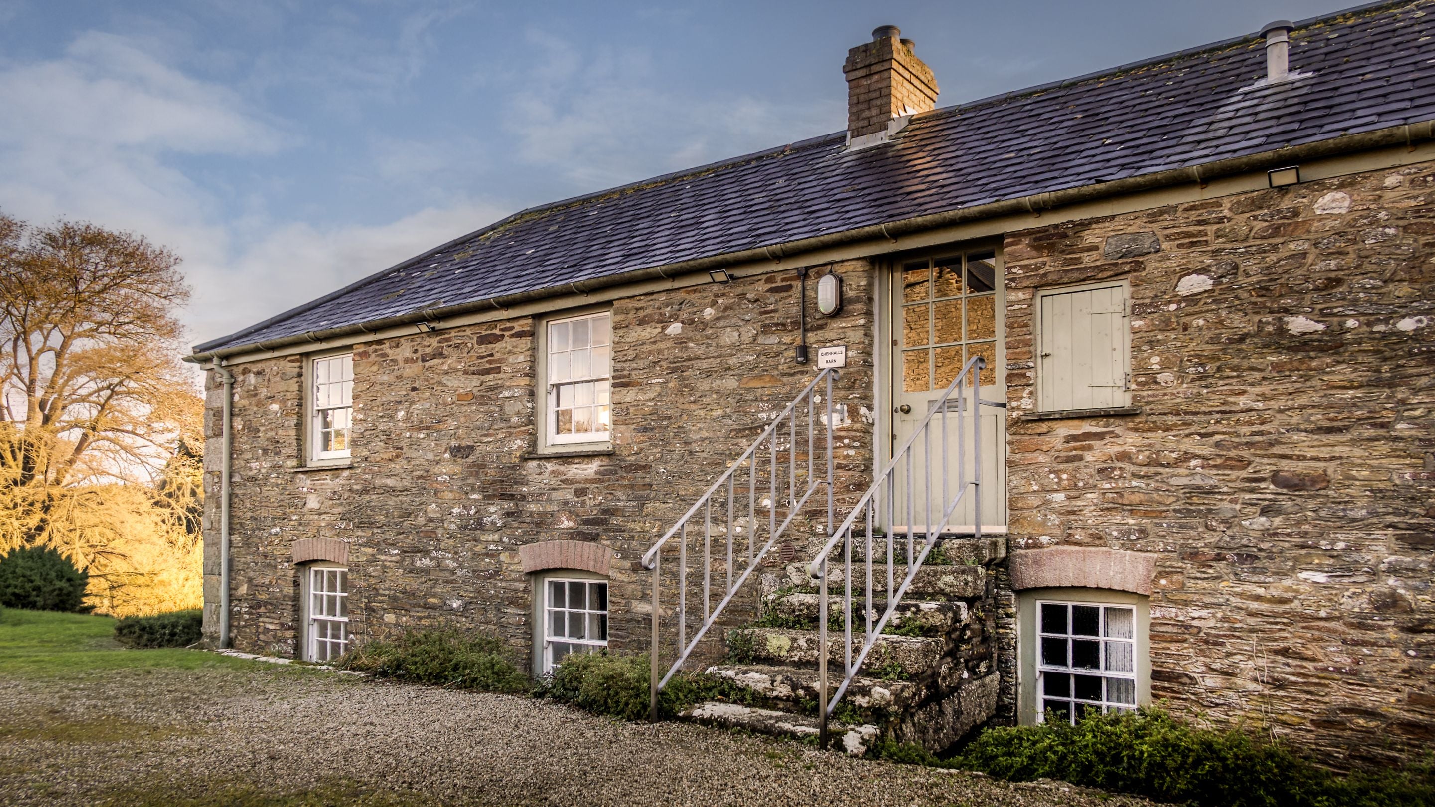 Chenhalls Barn with an exterior staircase leading to the front door on the first floor of the cottage, Cornwall,
