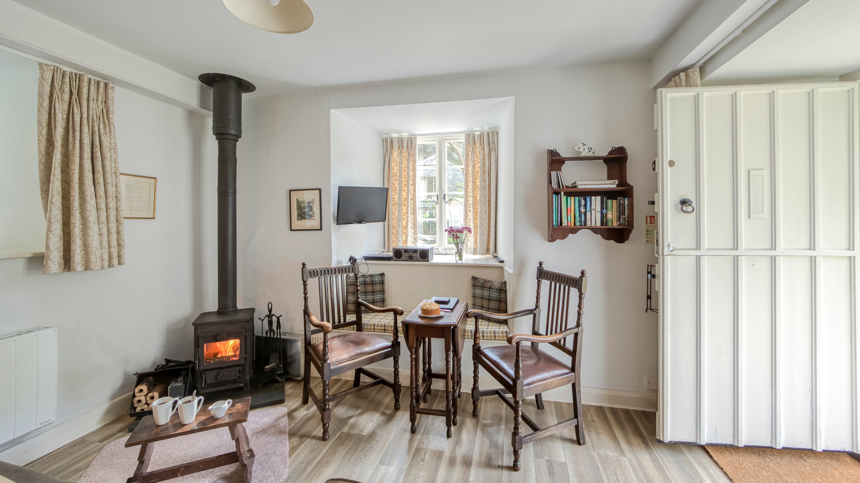 The sitting room and dining area at Cotehele Engine Cottage, Cornwall