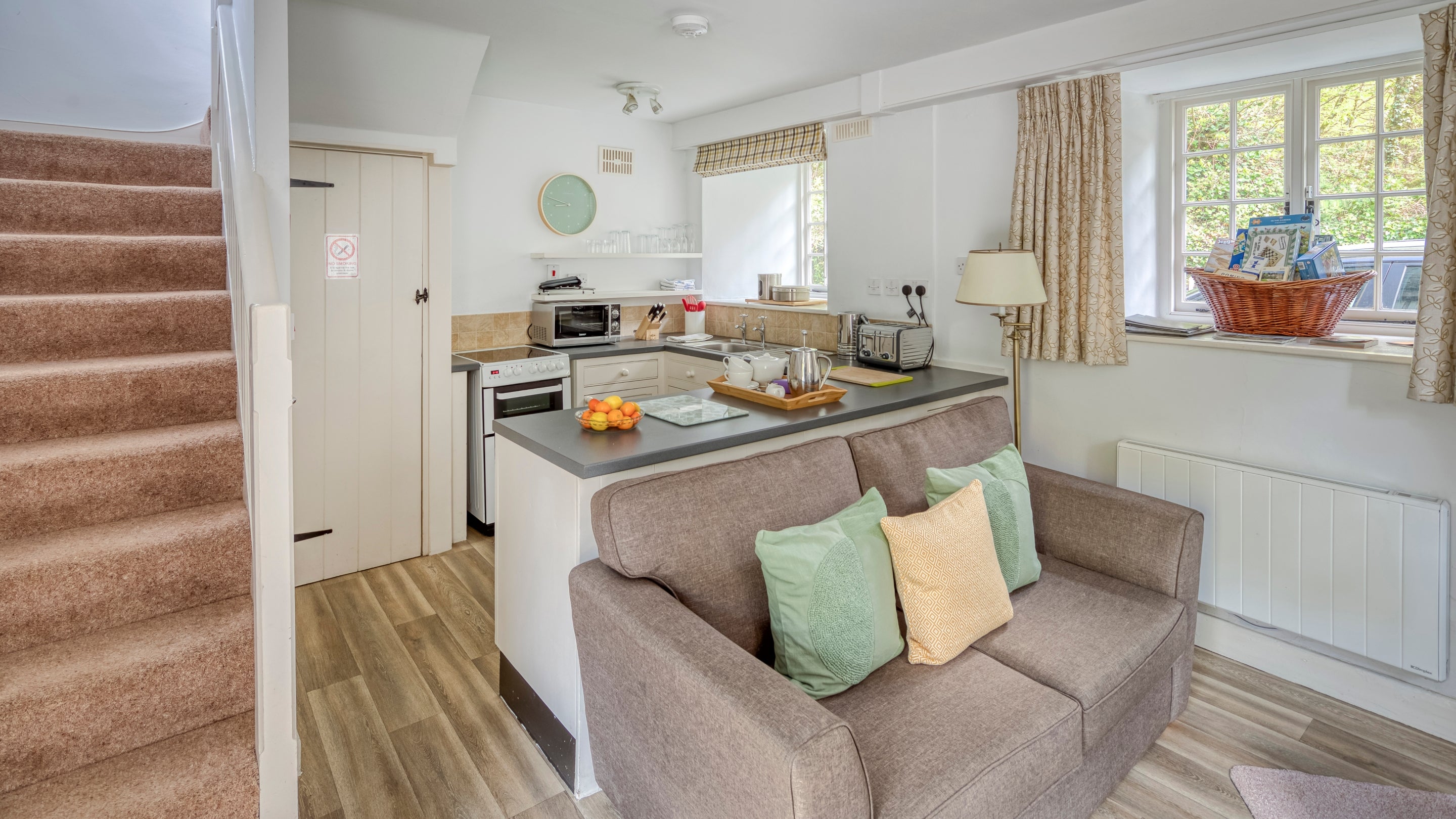 The open plan kitchen and sitting room at Cotehele Engine Cottage, Cornwall