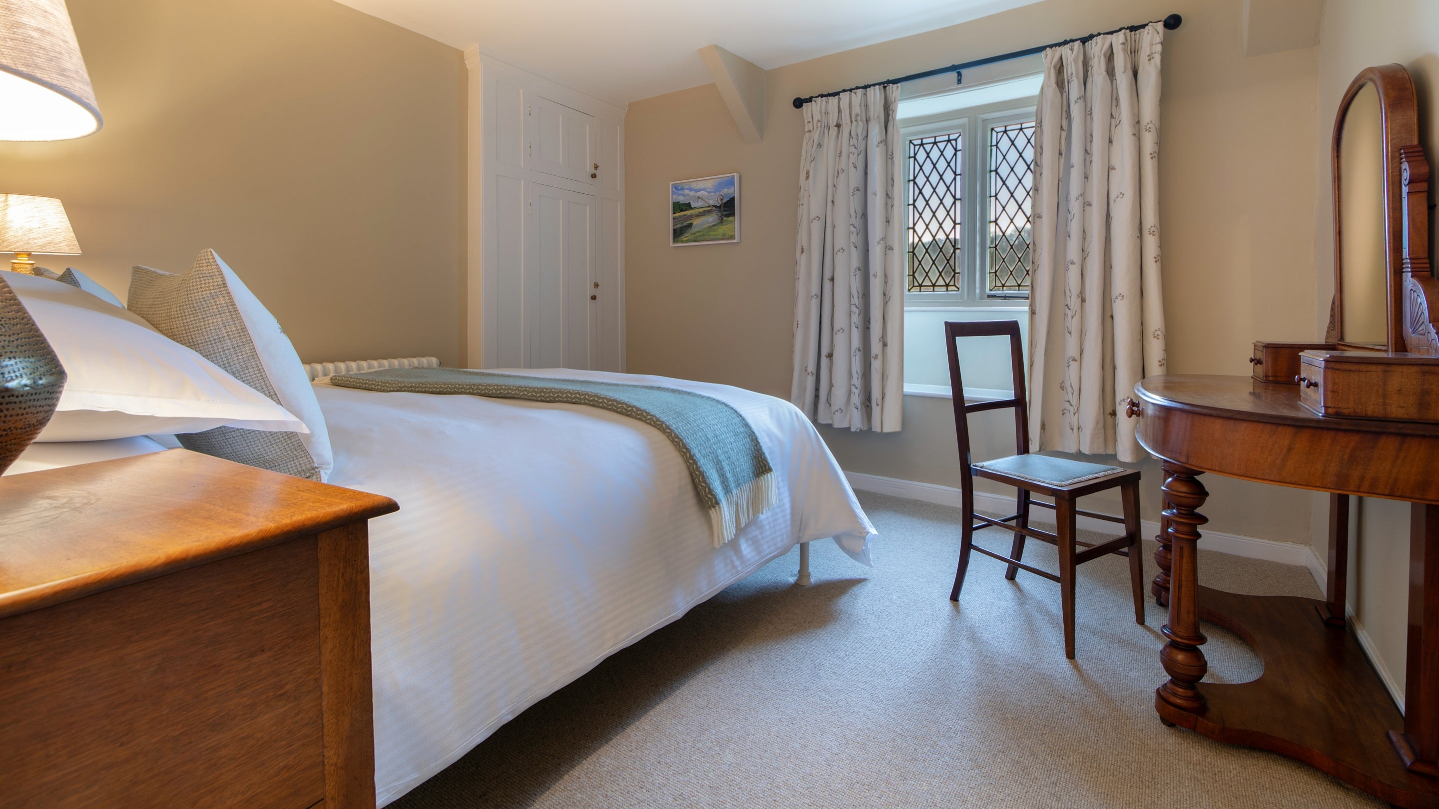 The king-size bedroom at Cotehele Quay Lodge Cottage, Cornwall