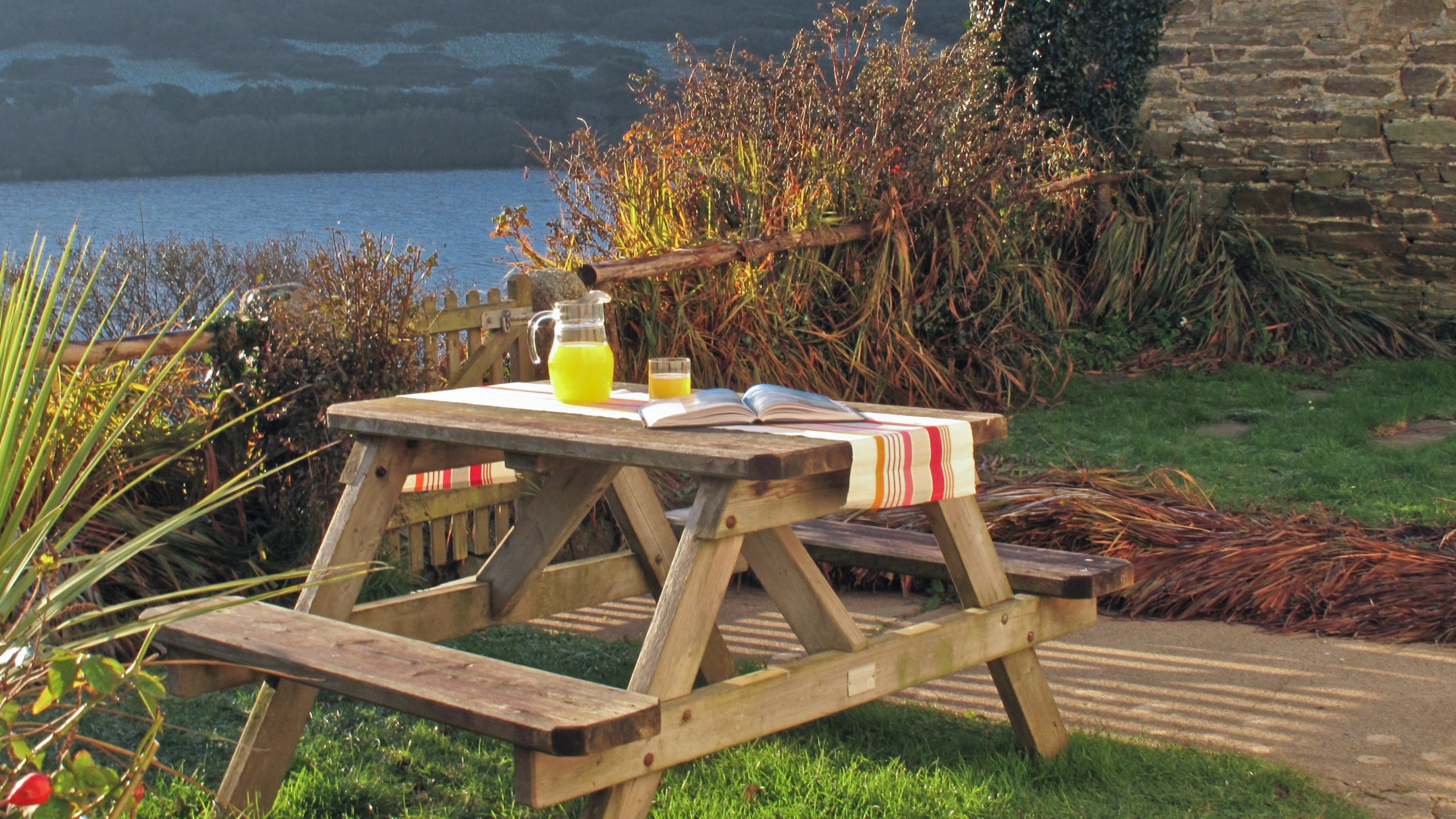 The picnic table in the garden at Degibna Lower Pentire Farm House, Cornwall