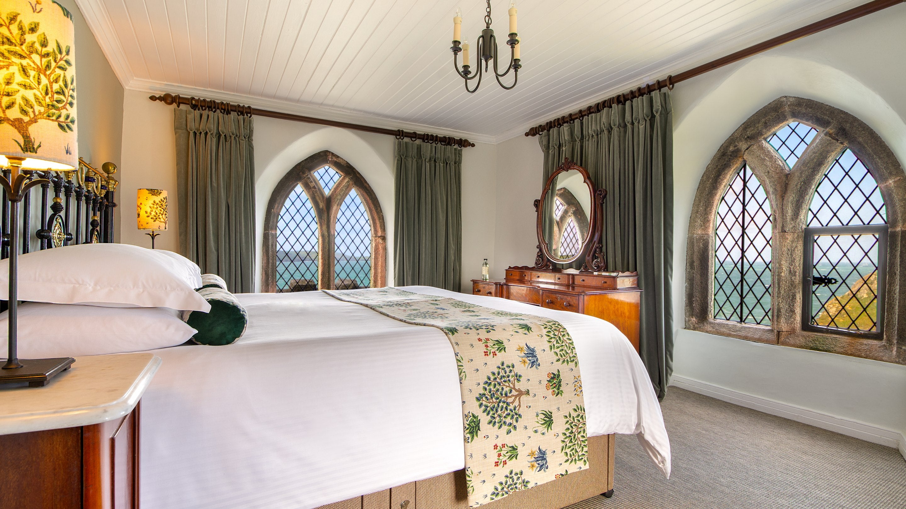 The double bedroom with views from three sides at Doyden Castle, Cornwall