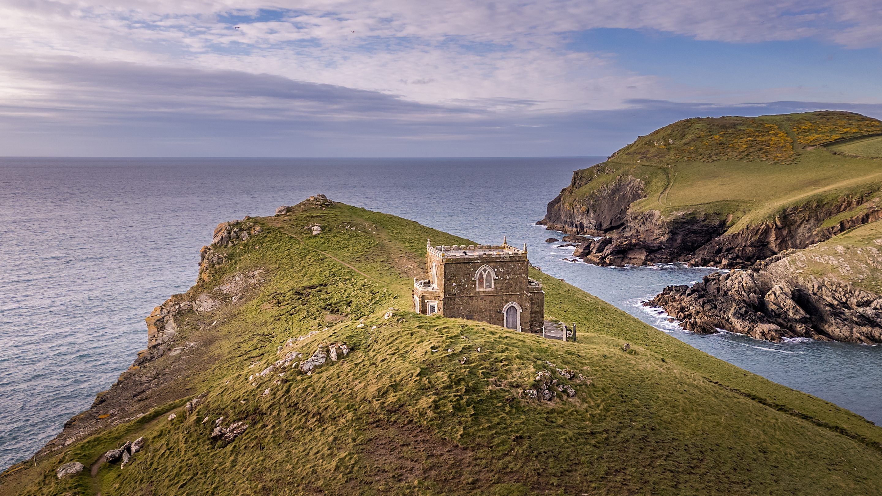 Doyden Castle on the Port Quin headland, overlooking the sea, Cornwall