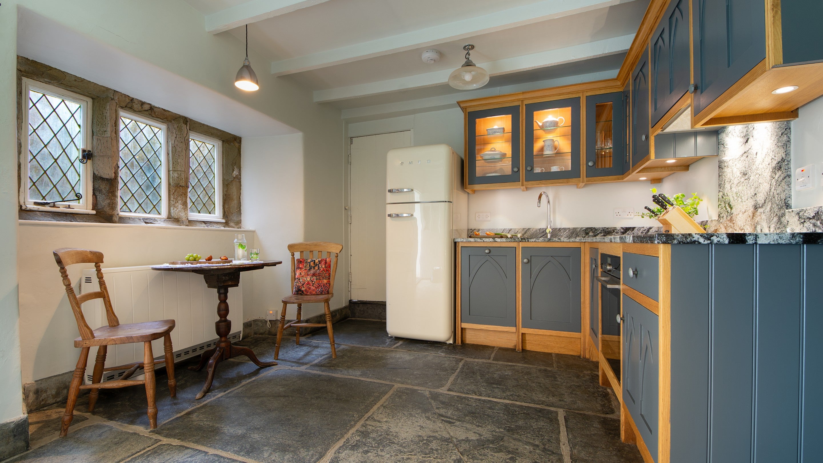 The breakfast table in the kitchen at Doyden Castle, Cornwall