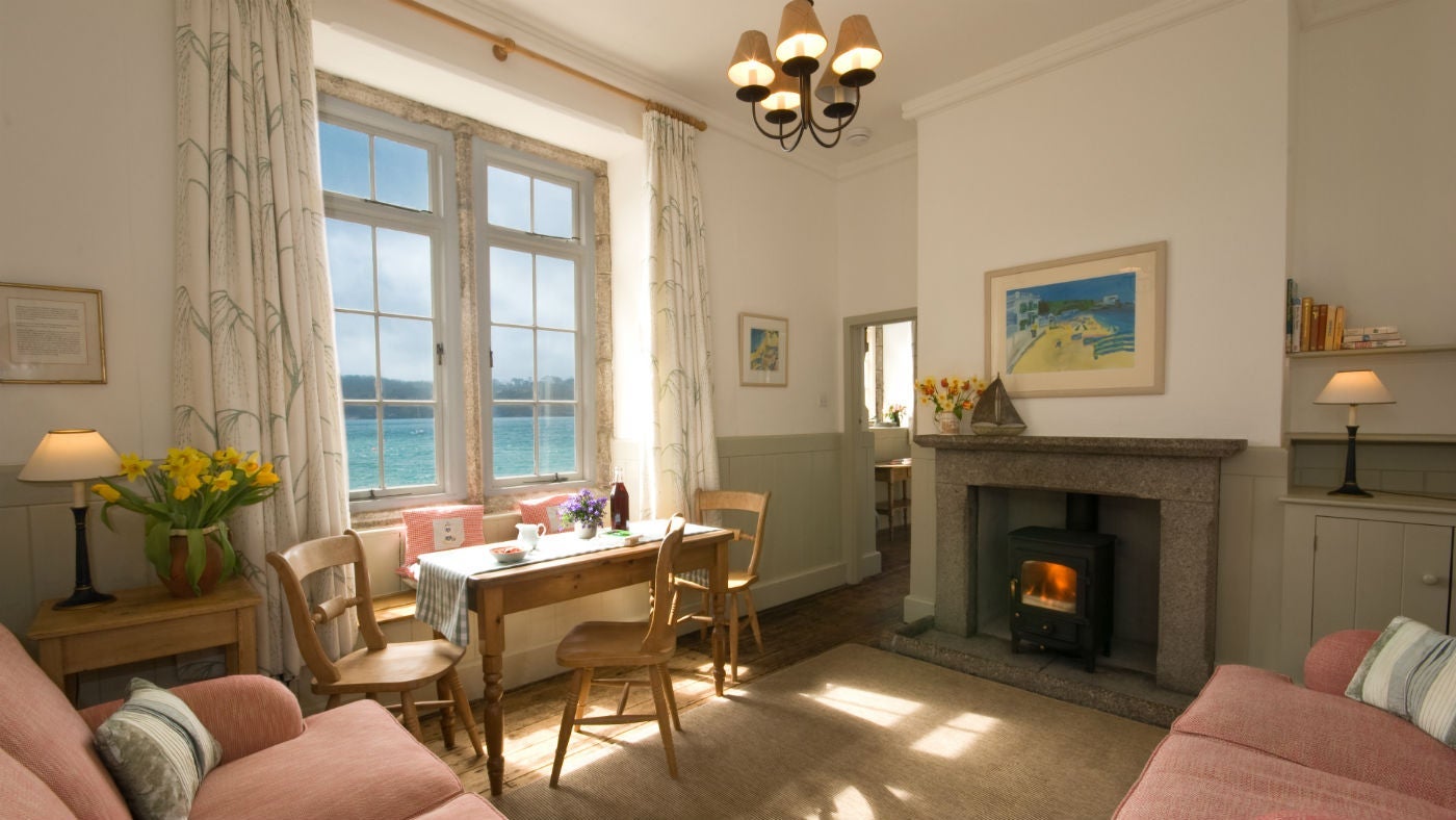 The sitting room and dining area at The Old School House, Durgan, Falmouth, Cornwall