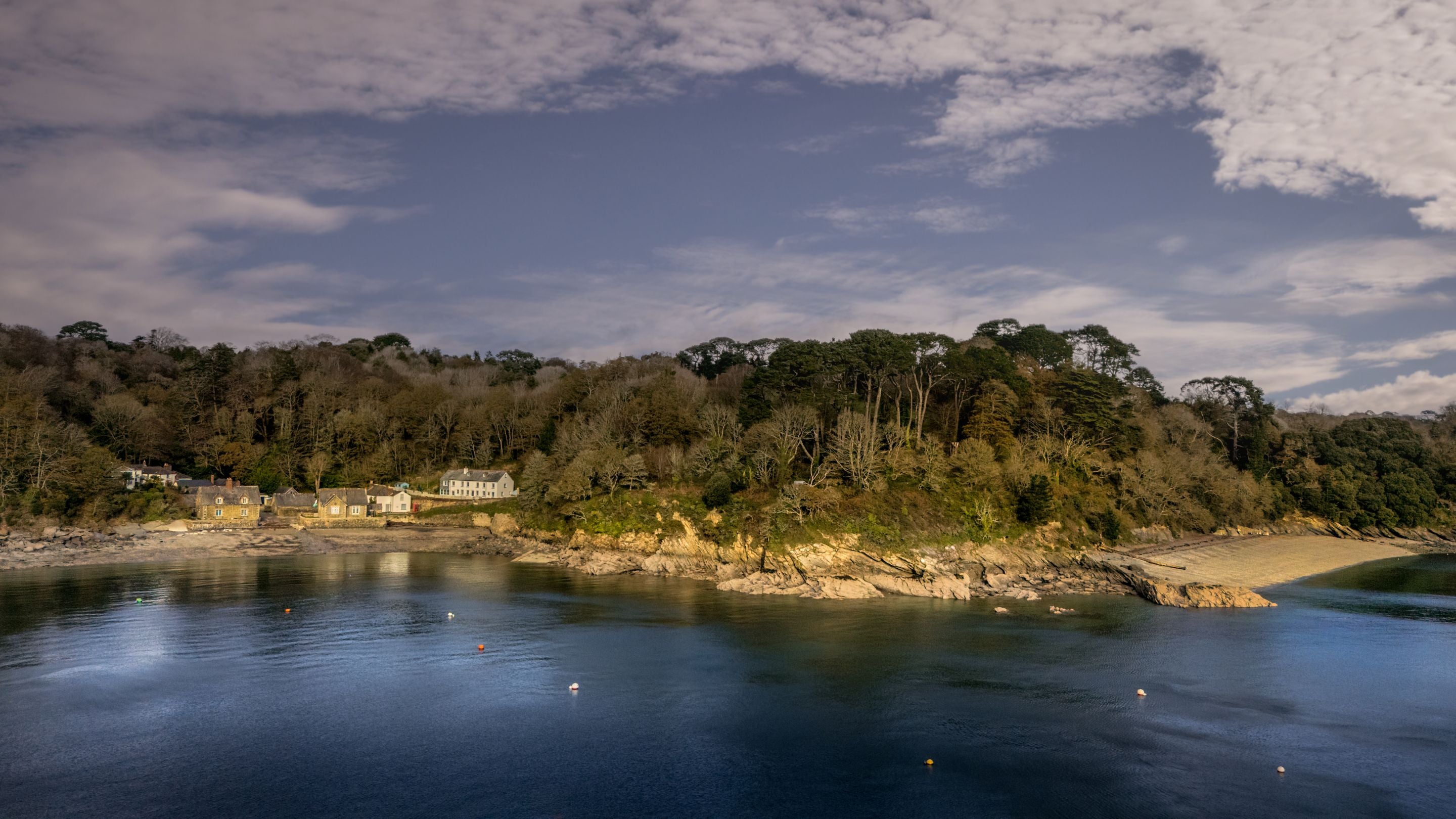 The cottages at Durgan and neighbouring Grebe Beach (on the right), Cornwall