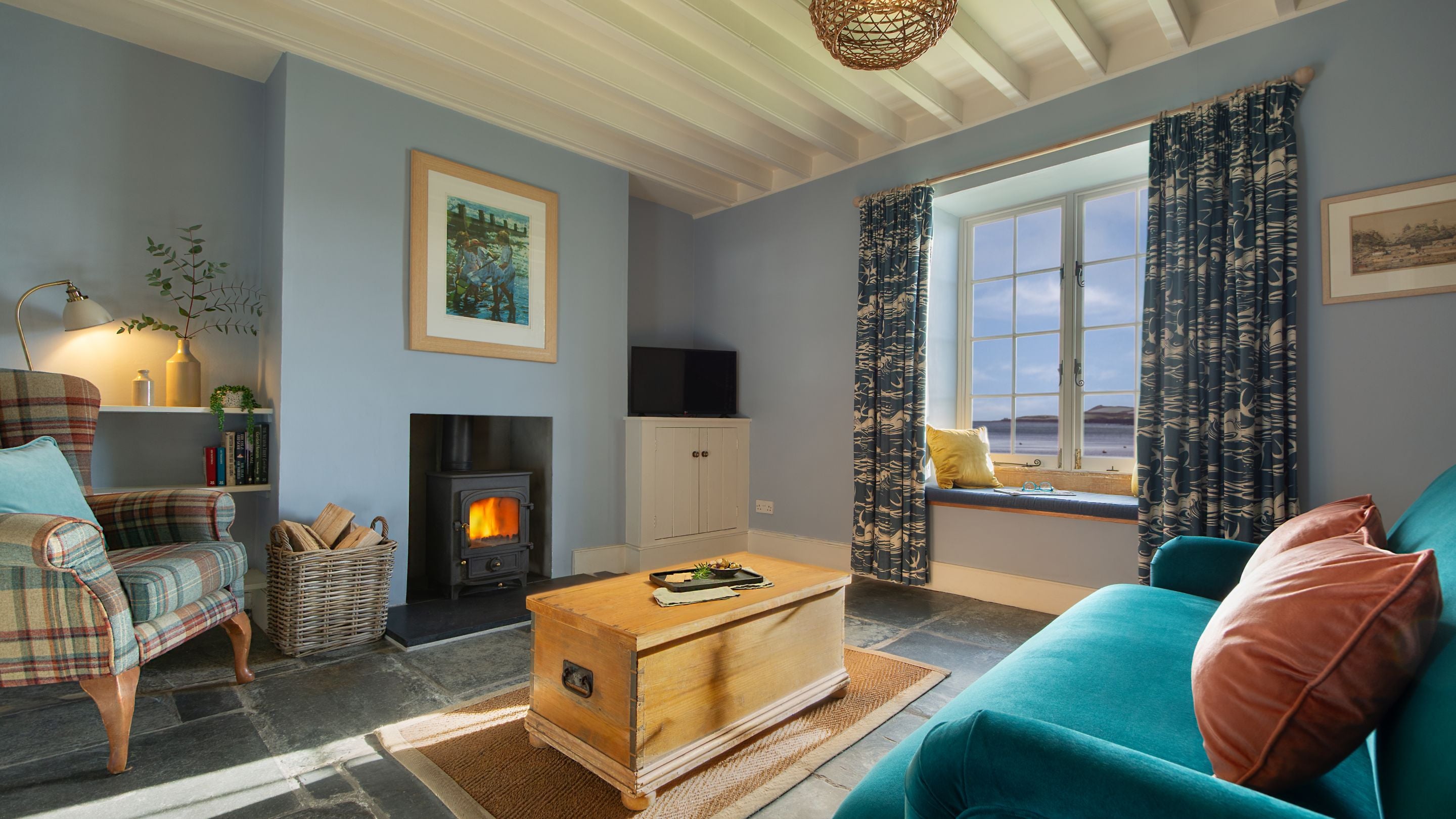 The sitting area in the open-plan living space at Durgan Quay Cottage, Cornwall