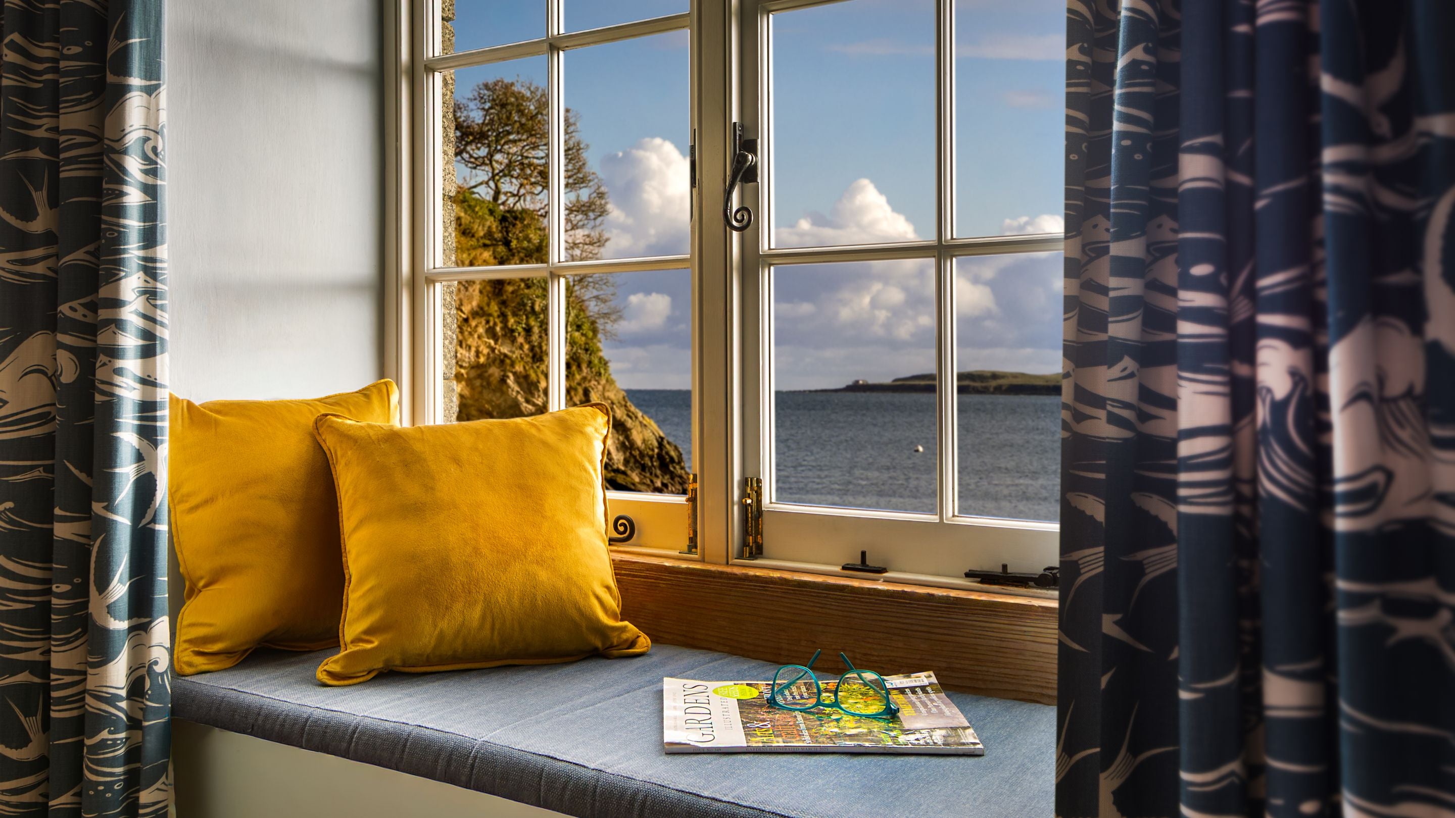 The window seat in the sitting area at Durgan Quay Cottage, Cornwall
