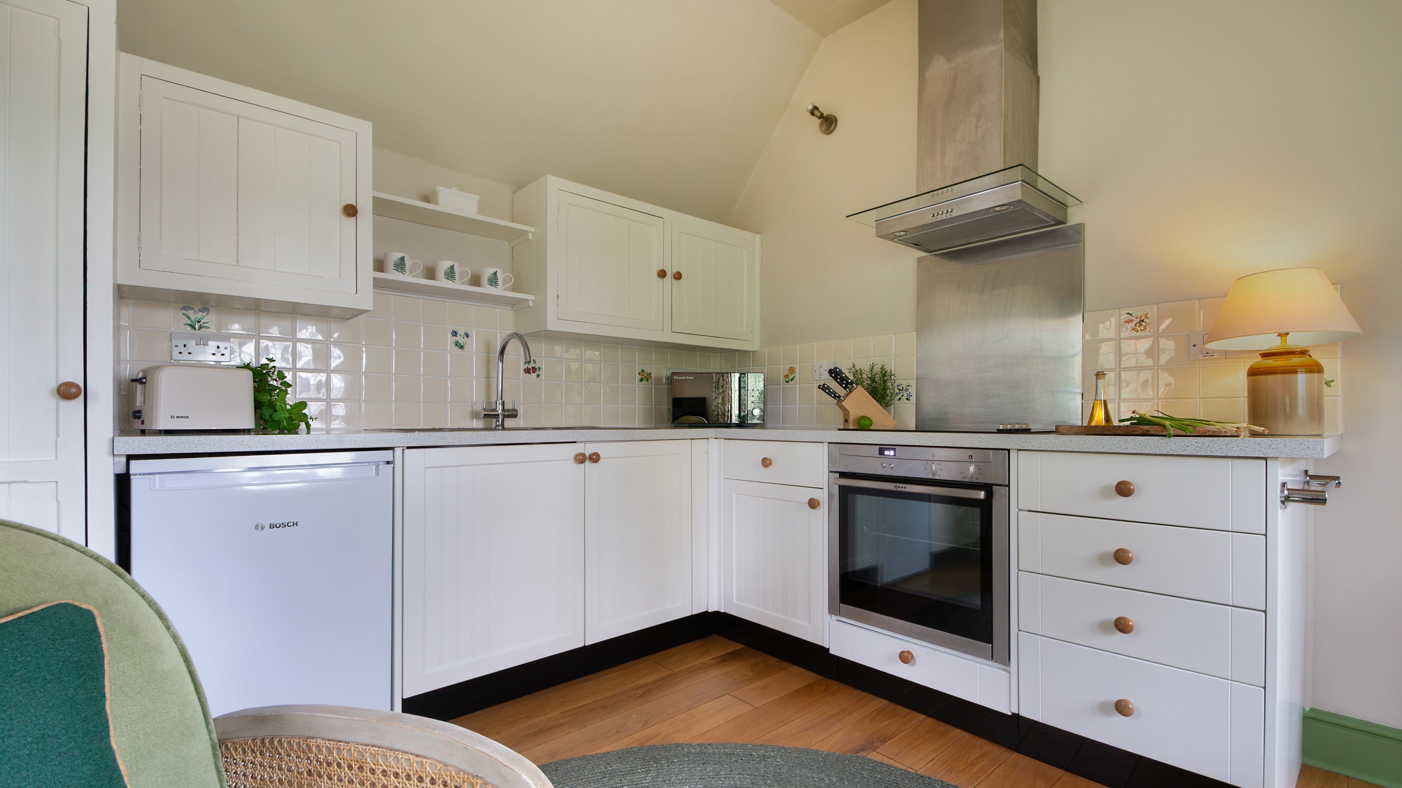 The kitchen area of the open-plan living space at Durgan Wood Cottage, Cornwall