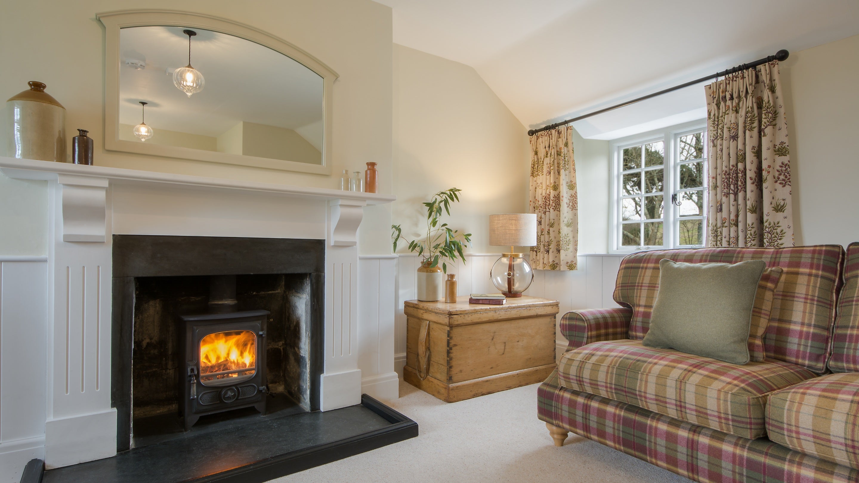 The sitting room with multifuel stove at Fortescue, Cornwall