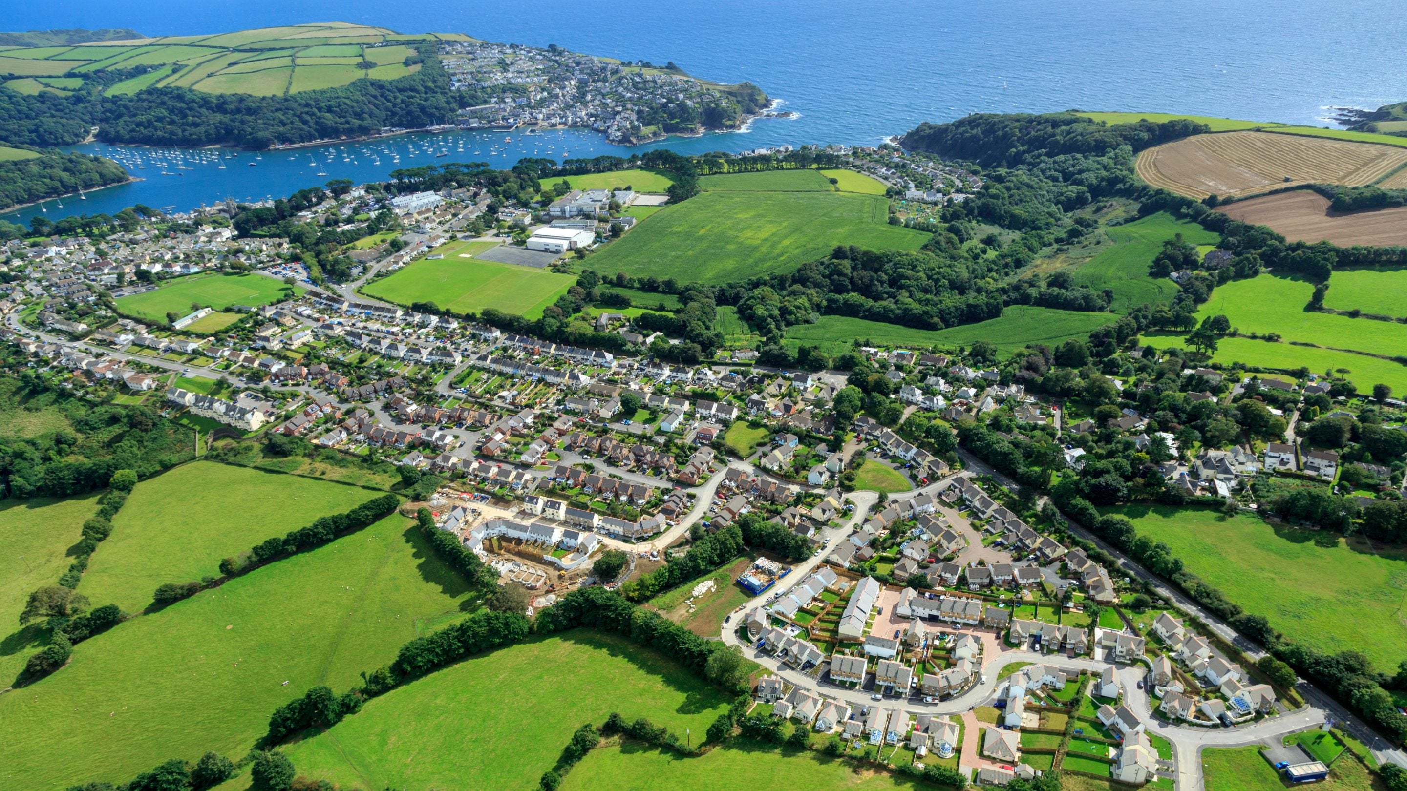 An aerial view of Fowey looking towards to the coast, Cornwall