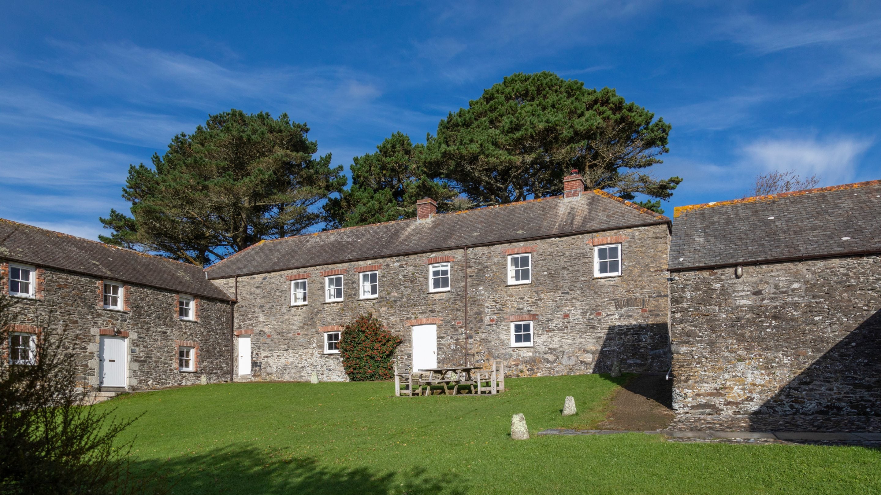 The shared garden with picnic table at Gwendra Granary, Cornwall