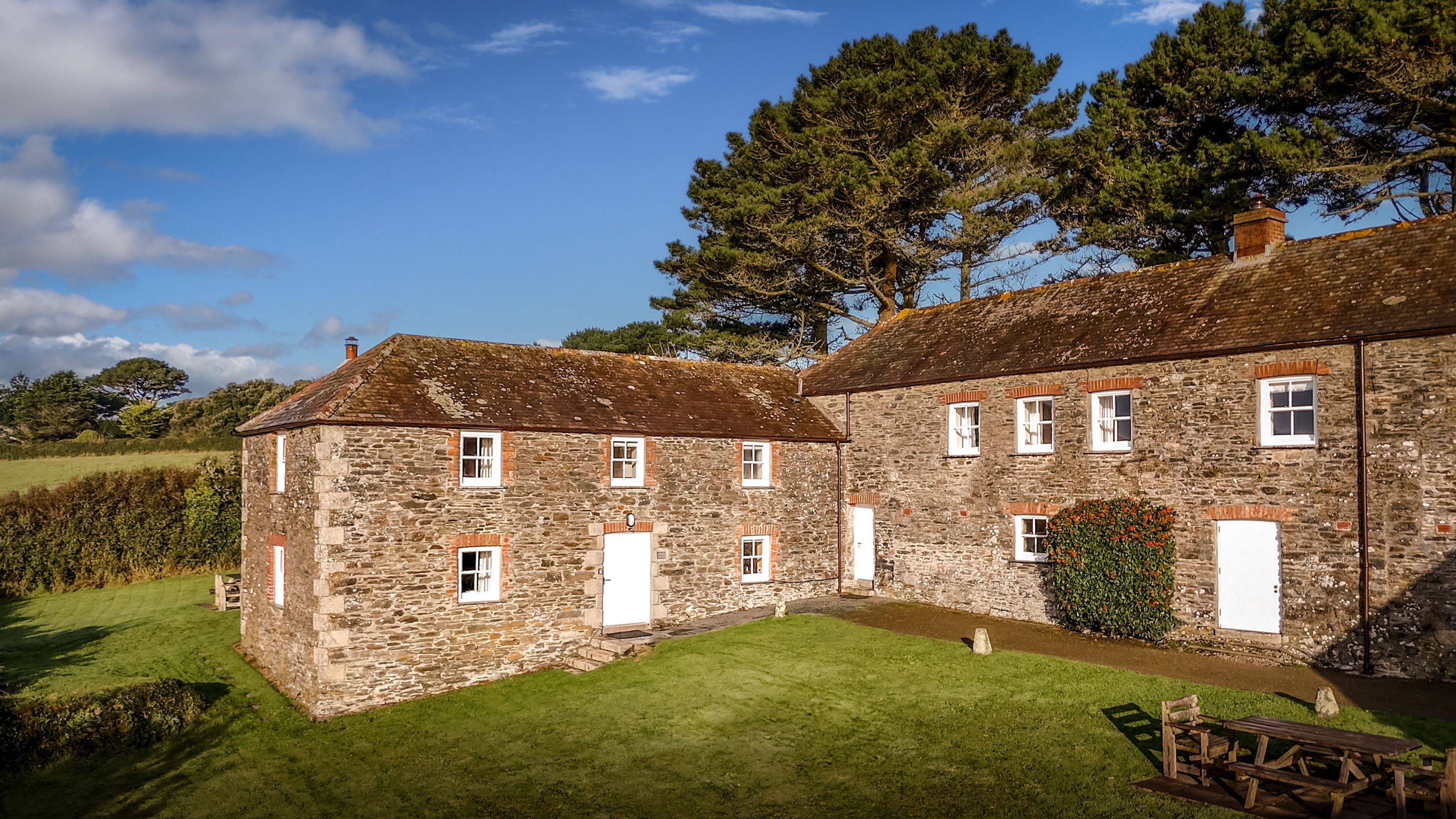 An aerial view of the exteriors of Mowhay on the left and Hayloft on the right, Cornwall