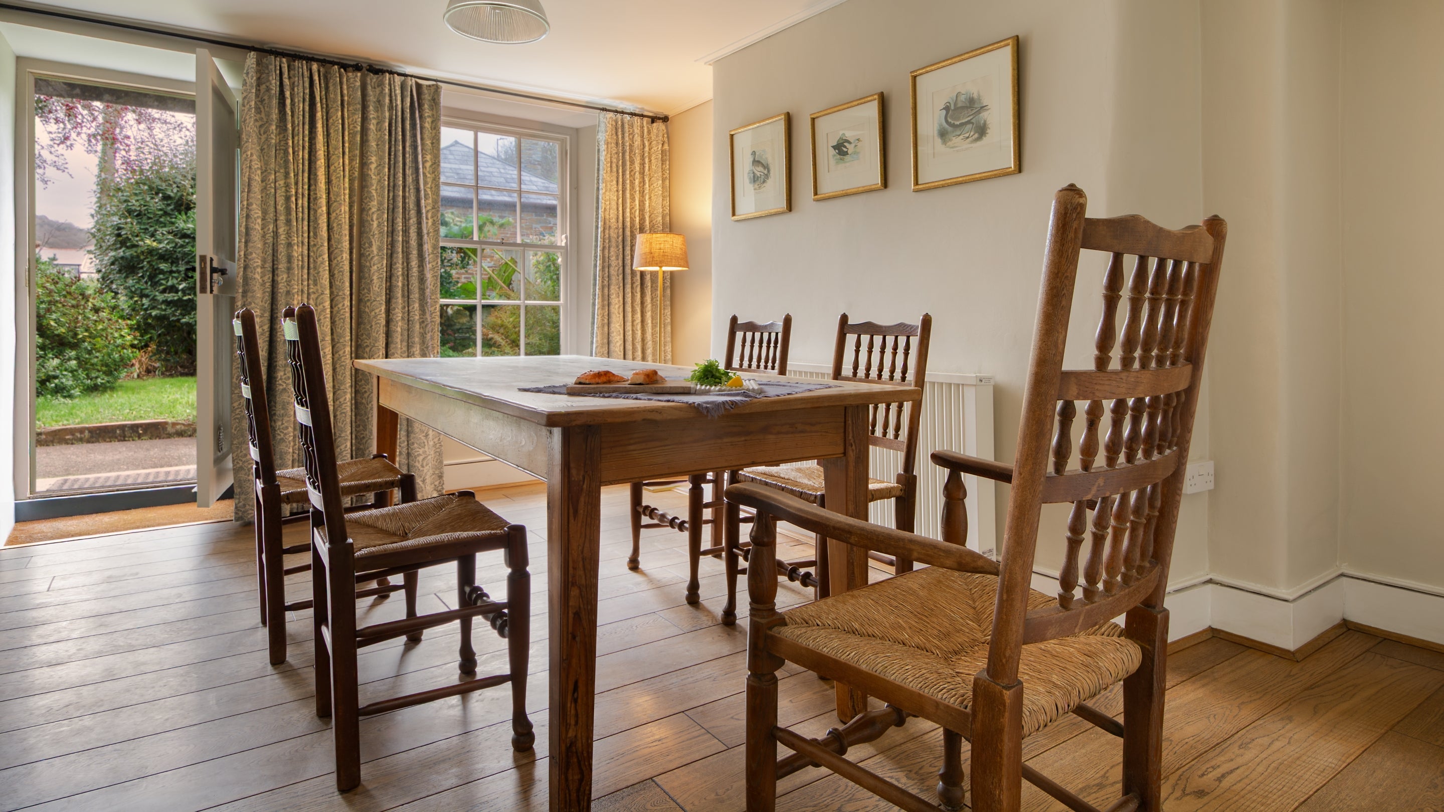 The dining table in the open-plan sitting and dining room at Harbour View, Cornwall