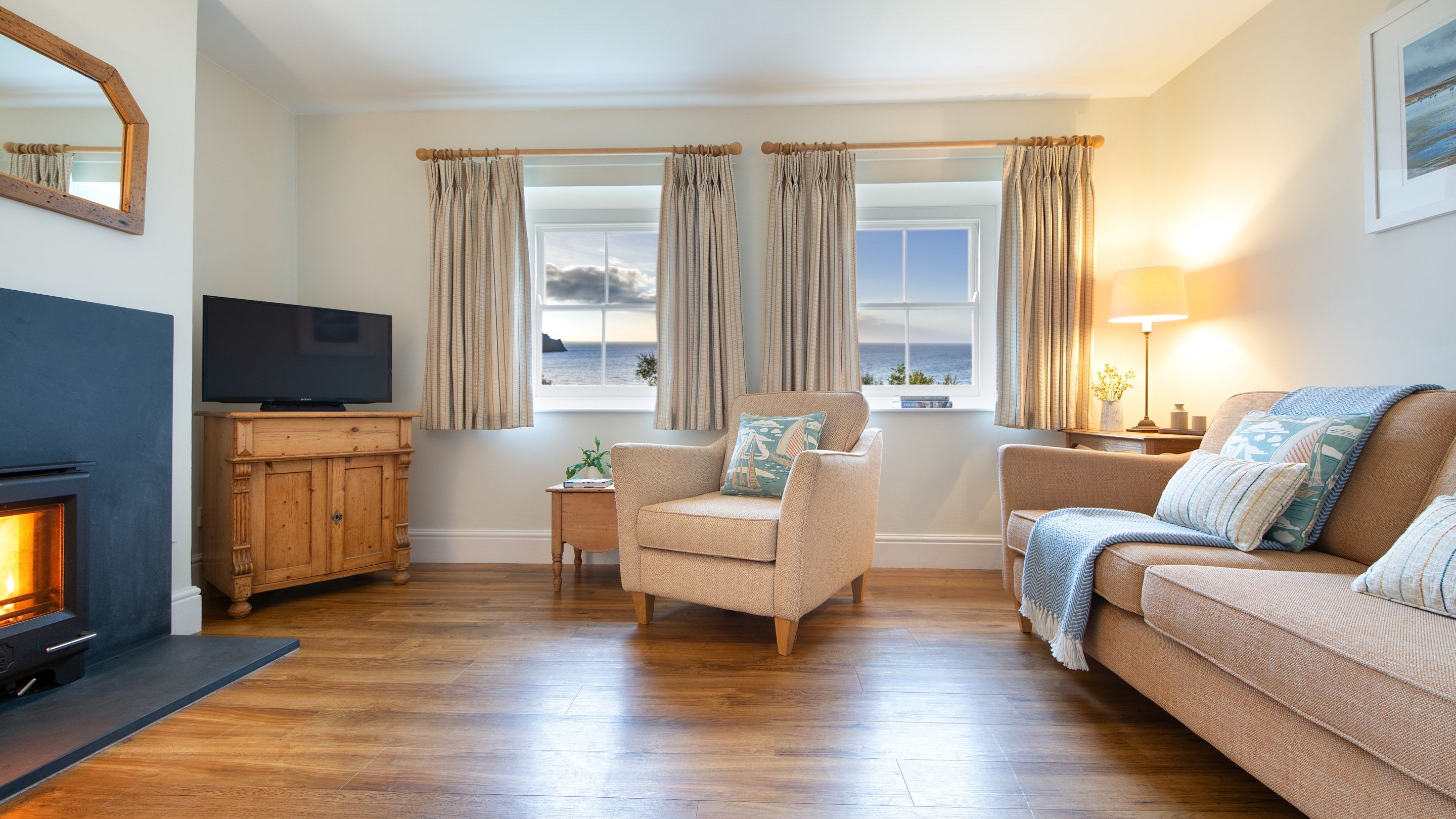 The sitting room, with sea views, at Hayloft, Cornwall