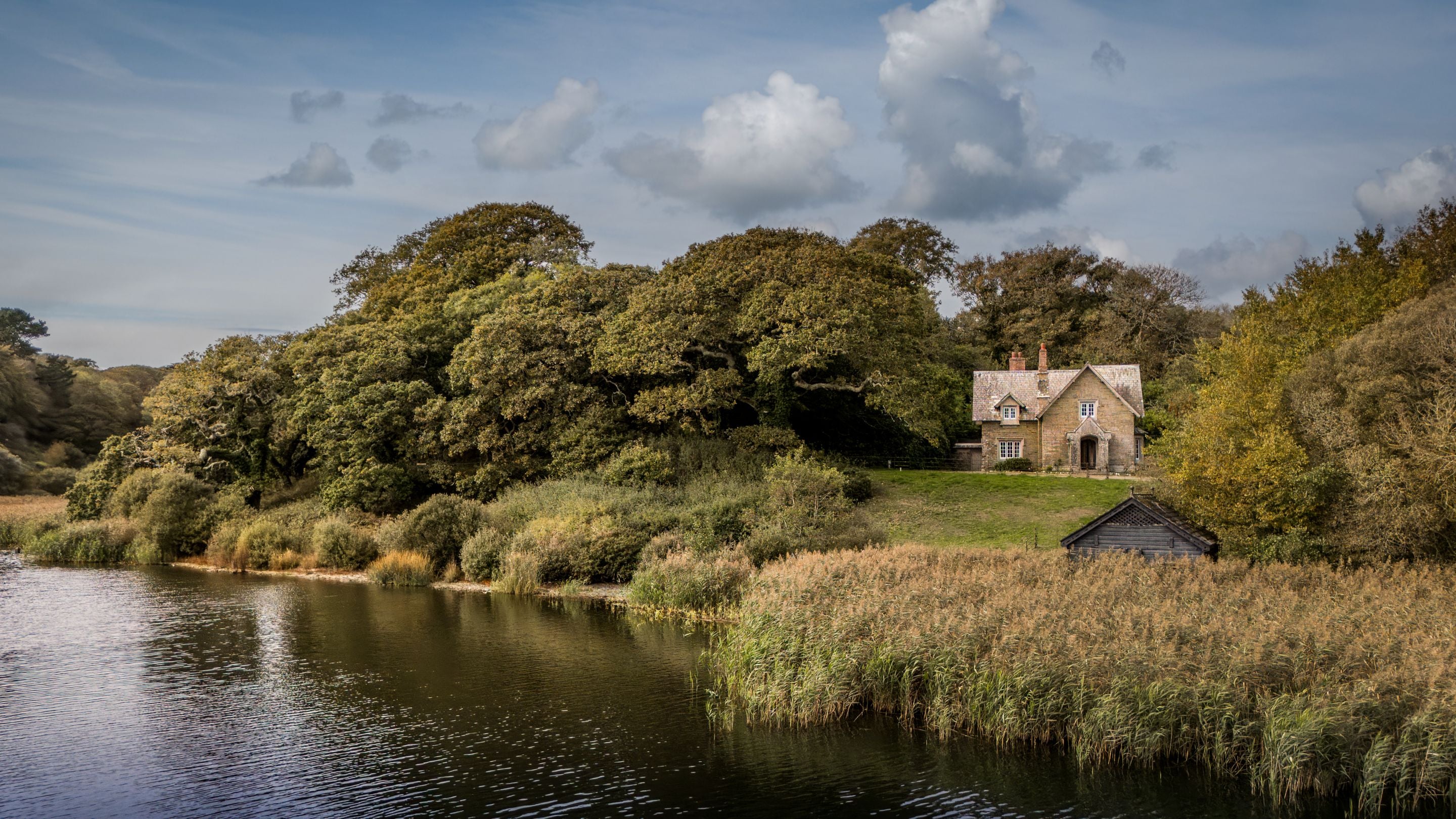An aerial view of Helston Lodge overlooking Loe Pool, Cornwall