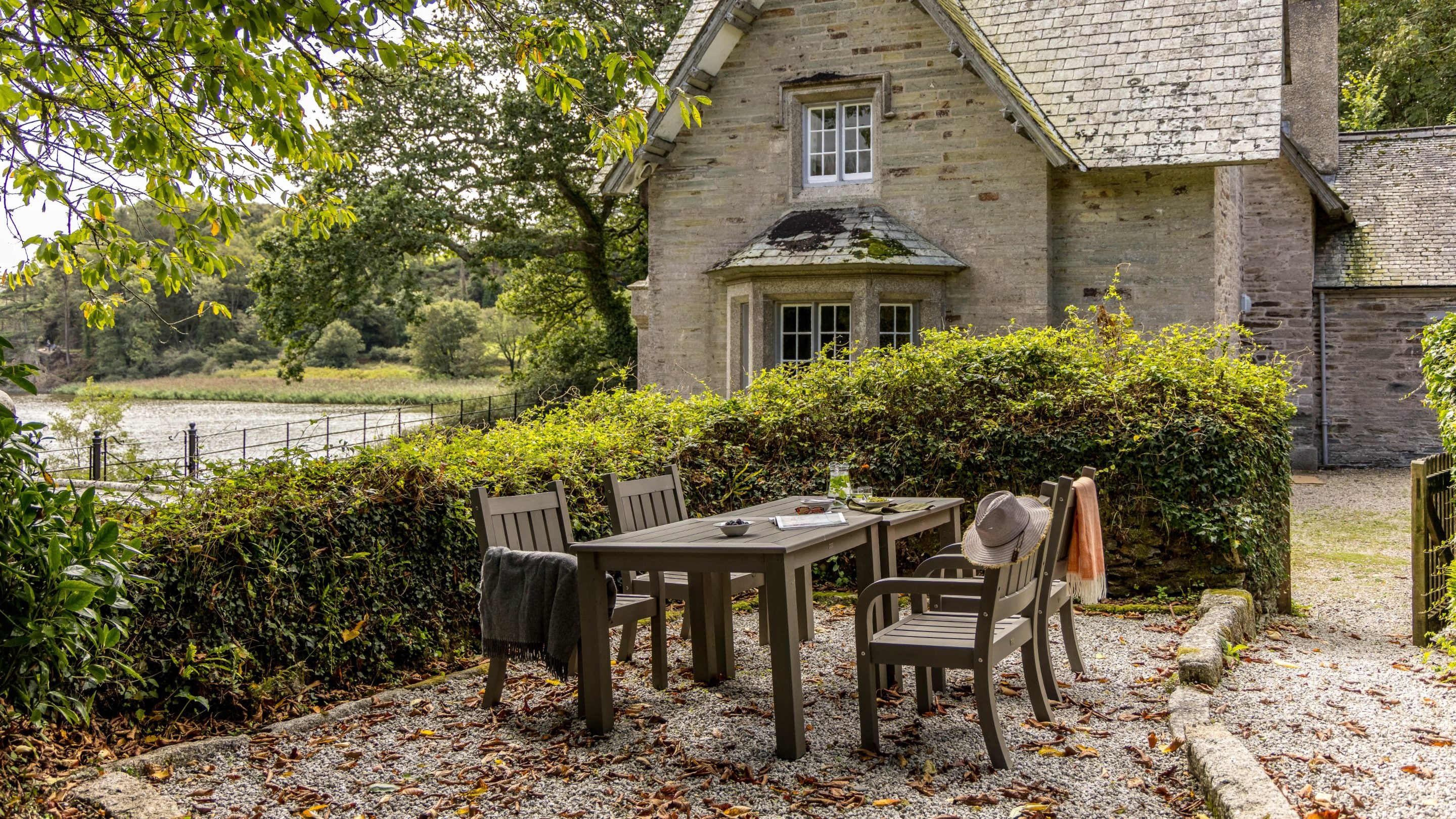 The garden with table and chairs at Helston Lodge, Cornwall