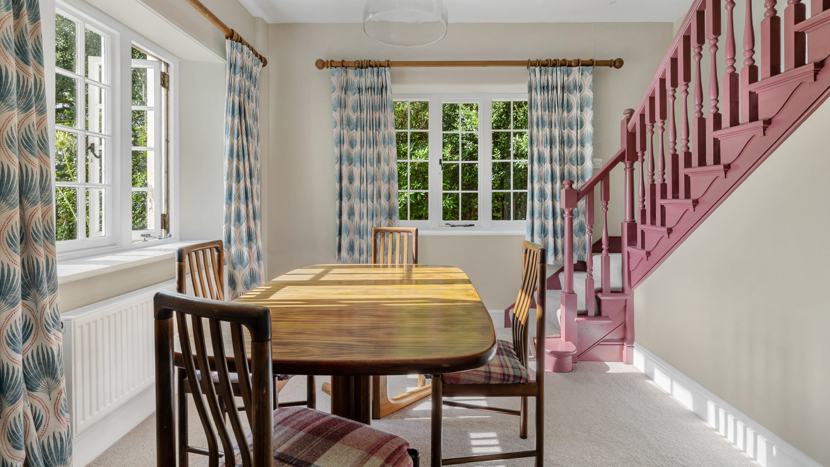 The dining room and stairs to the first floor at Helston Lodge, Cornwall