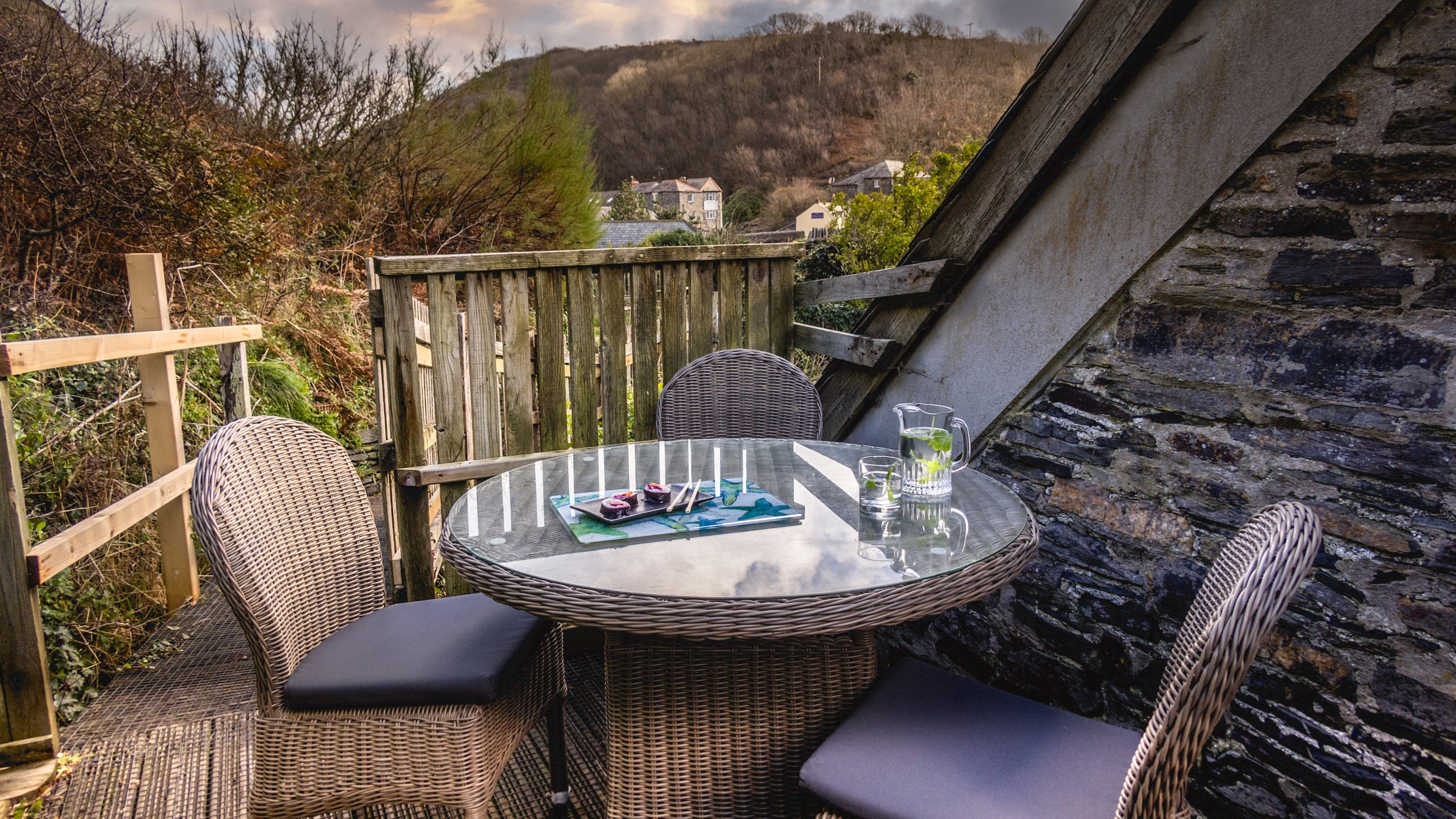 Seating on the decked area by the front door at The Lugger, Cornwall