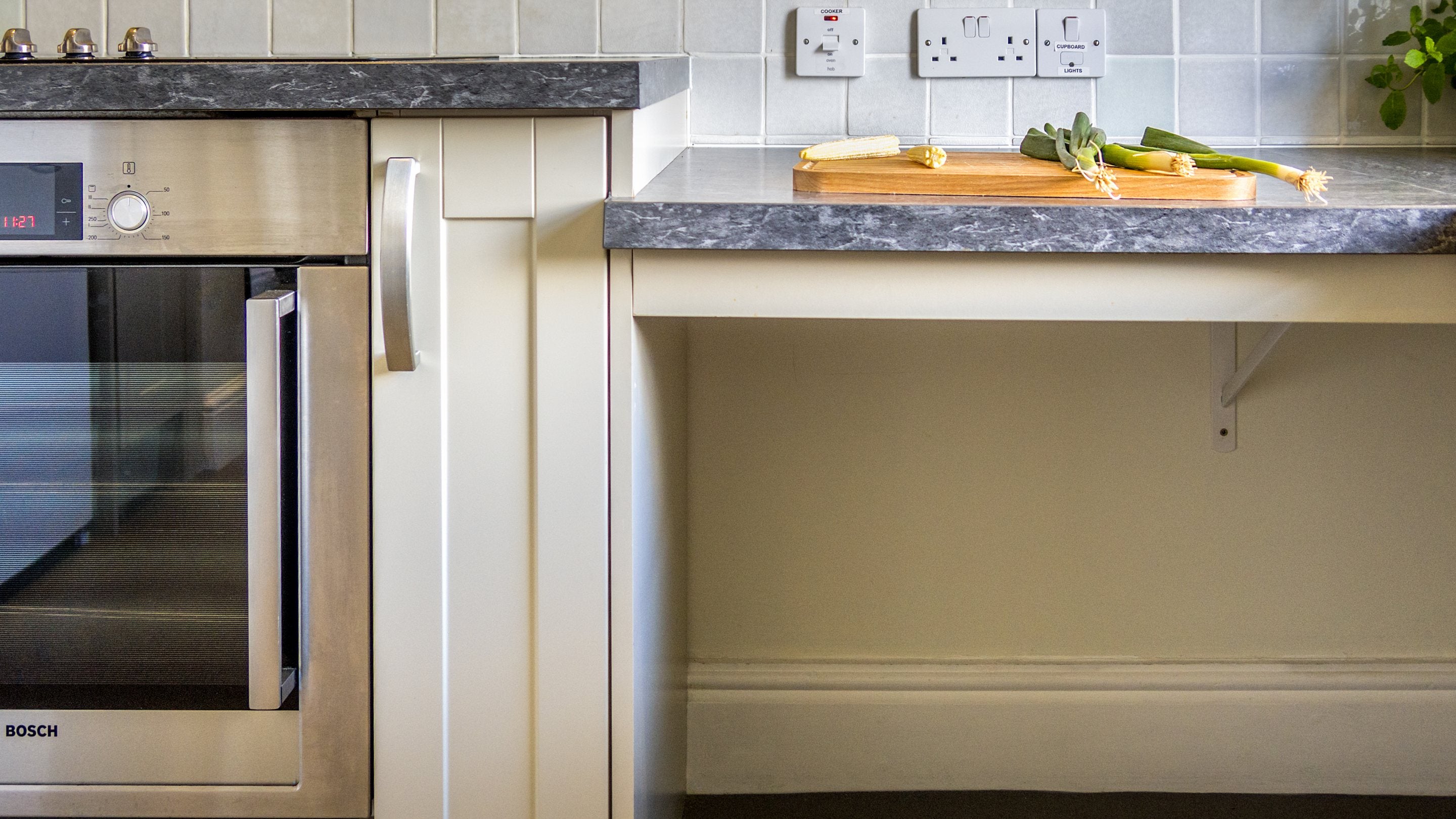 The kitchen at The Major's Quarter, with under-counter space and side-opening oven door, Cornwall