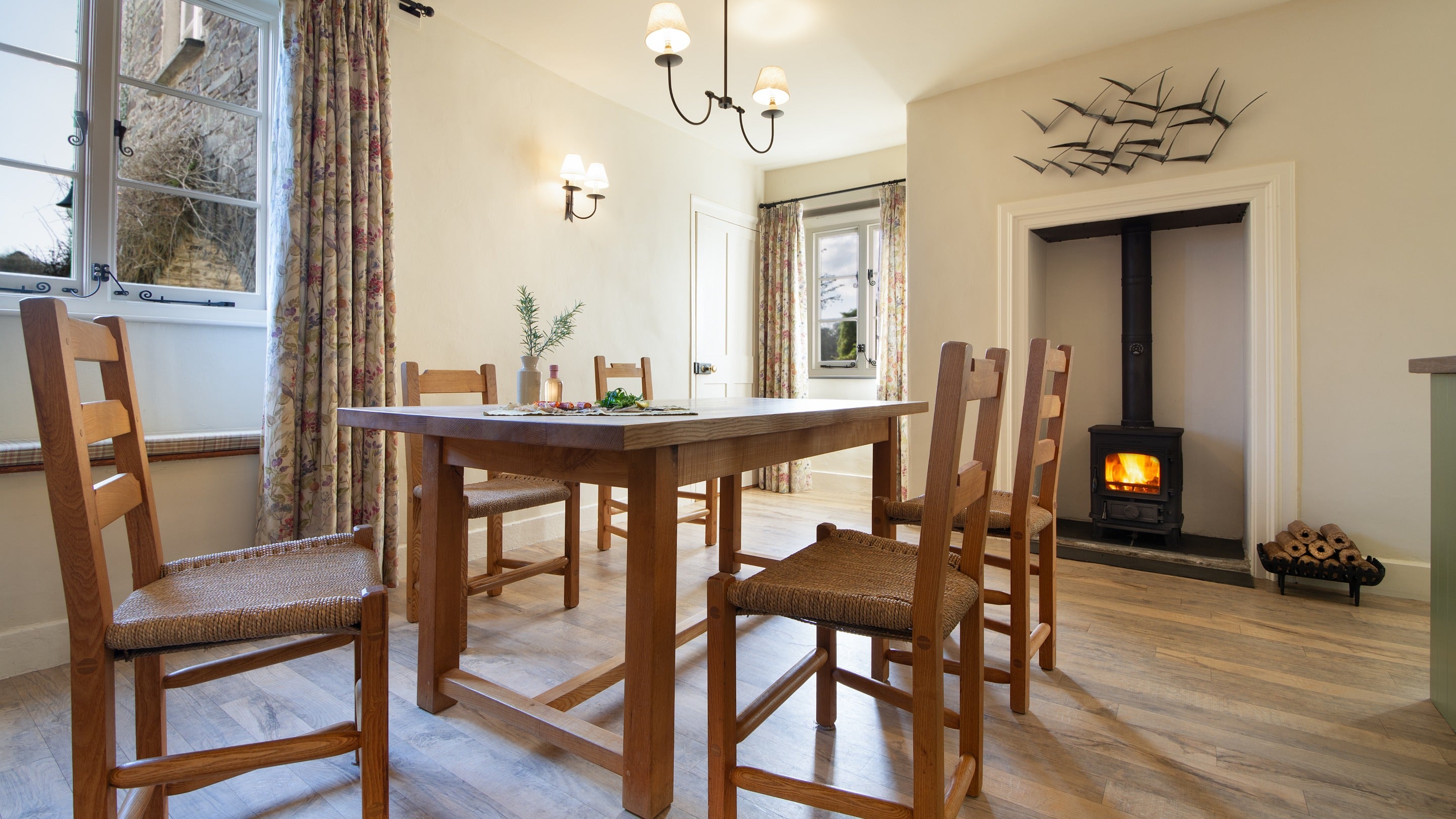 The dining area with multi-fuel stove at Malt House, Cornwall