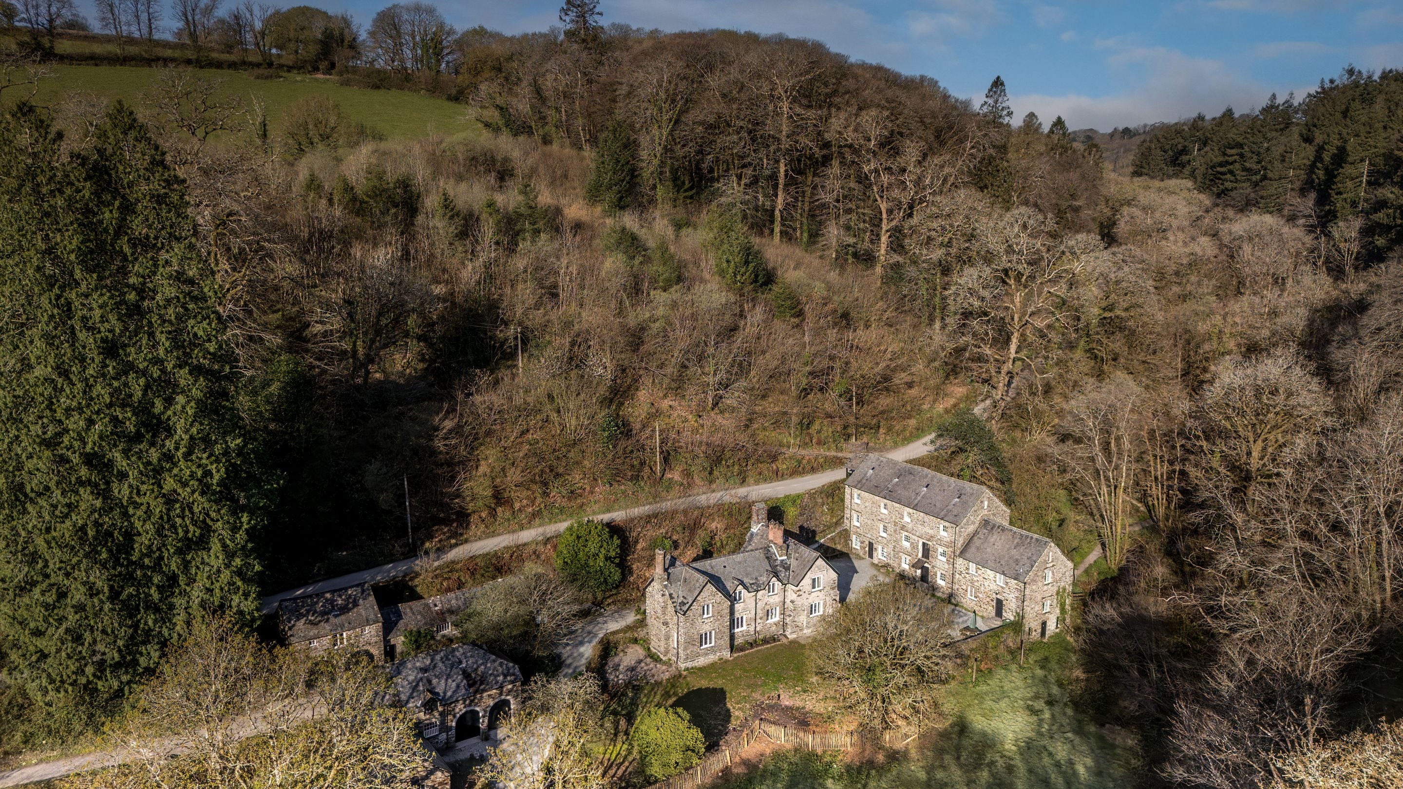 An aerial view of Miller's House and neighbouring Cotehele Mill, Cornwall