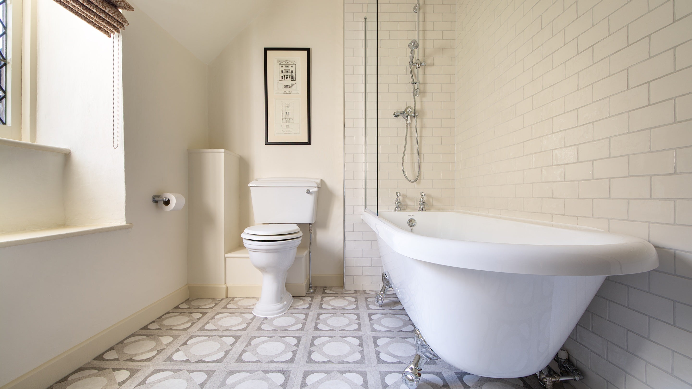 The bathroom at Miller's House, with shower over the roll-top bath, Cornwall